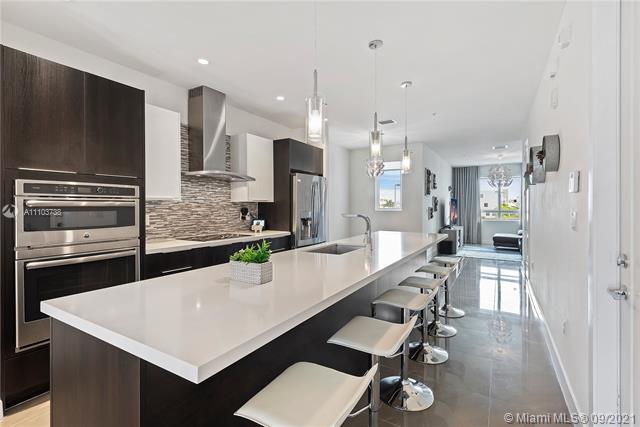 Unique opportunity to live in Landmark! This contemporary condominium is charming and smart, with a floor plan that expands to 3 stories, including a private 1-car garage. Spacious living area totals 1,923 Sq.Ft. with 3 bedrooms, 2 full bathrooms and 1 half bathroom. This condo also features porcelain tiles throughout the entire residence, large entertainment kitchen area with top-of-the-line appliances and an island that comfortably sits 6 with quartz countertop and wine cooler. Master suite includes a walk-in closet and master bath features dual floating sinks with glass enclosed vanity & shower. Residents can enjoy the expansive clubhouse with fitness and resort-style pool. Located in the heart of Doral.