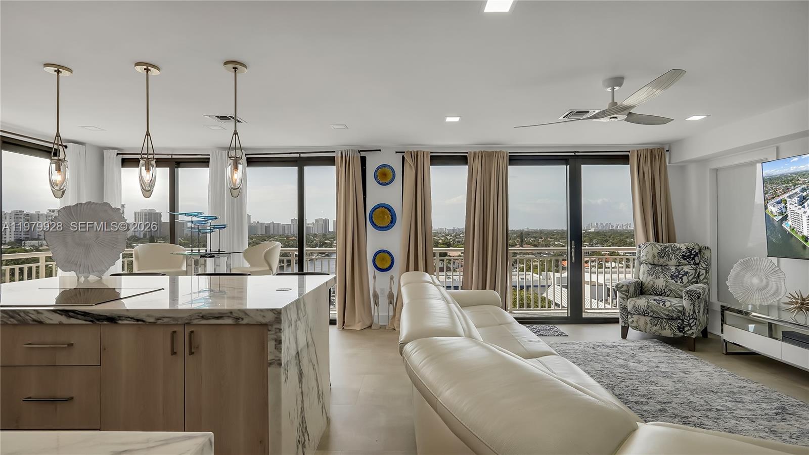 Stunning, fully remodeled corner penthouse offering luxury living at its finest. This unique residence features a private, gated front entrance terrace and breathtaking panoramic views of the Intracoastal, ocean, and city skyline. Floor-to-ceiling impact windows flood the space with natural light and create a seamless indoor-outdoor connection. The modern open-concept design highlights high-end appliances, a double granite waterfall countertop, and sleek contemporary finishes throughout. Private patio area offers a quite, secluded space ideal for relaxing. Prime Fort Lauderdale location close to beaches, dining, and entertainment.