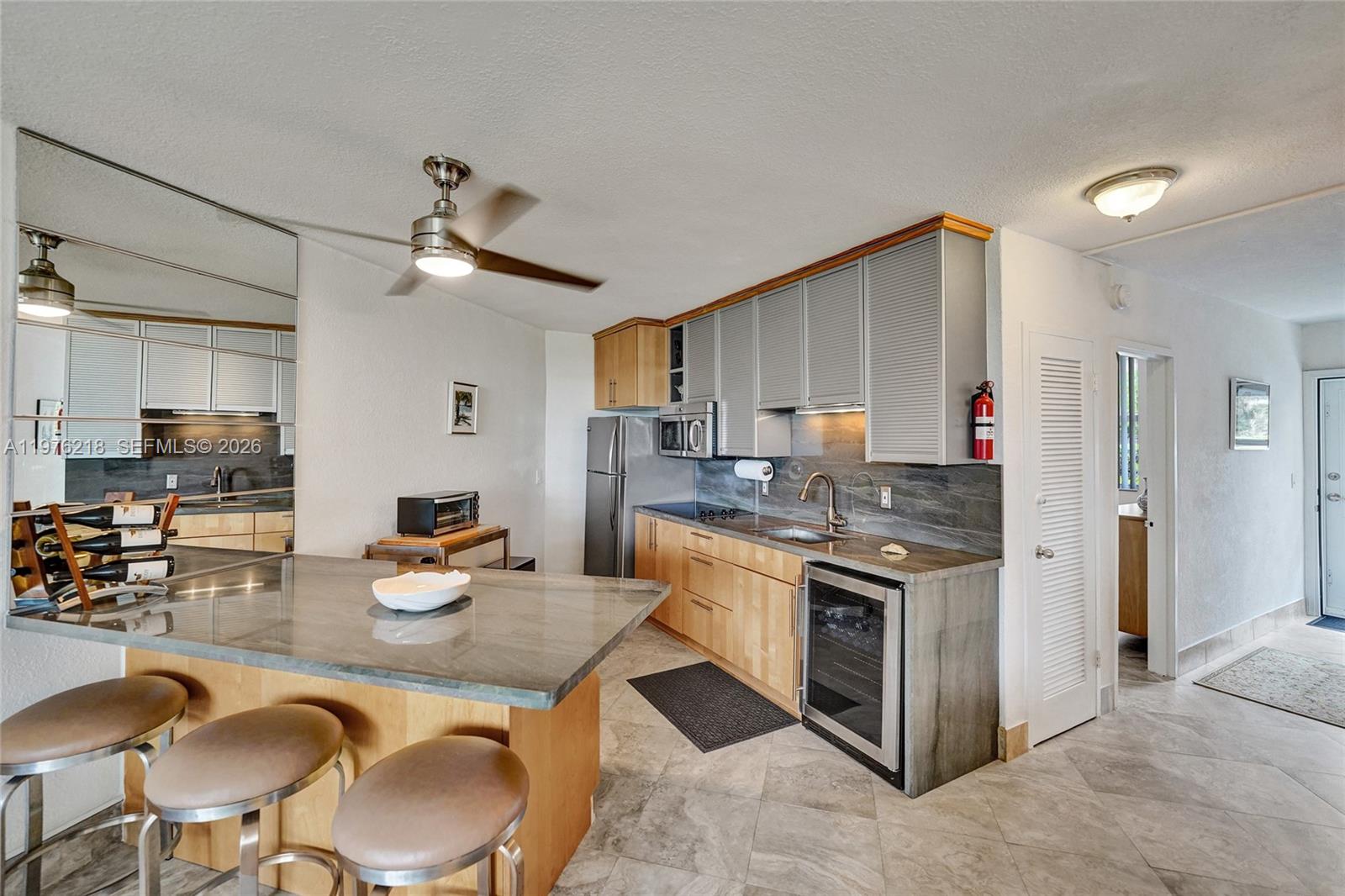 LOCATION: Just step out your front door and sink your toes in the sand. Bldg has passed 40/50/60 yr inspections. Enjoy morning coffee at the pool, enjoying beautiful Sunsets & Sunrise views. Age 55+> This impeccably undated Unit features 2 bright/spacious bedrooms & 1 updated bathrooms, step in shower. High quality upgrades in large open recently updated concept kitchen features SS appliances. Beautiful porcelain tile throughout, Marble Island & Countertop Impact Windows & front Door & Accordion shutters. Bldg has passed 40/50/60 yr inspections. Low HOA. No current assessments. Unit on the 1st floor, parking spot right in front of the unit. Common Laundry on 1st floor. Heated Pool. Rent 1x lifetime. Service pets only. Publix right up the street, Close to Gulfstream Racetrack, Casinos, Ft Lauderdale Airport Fully furnished. Updated electric & plumbing