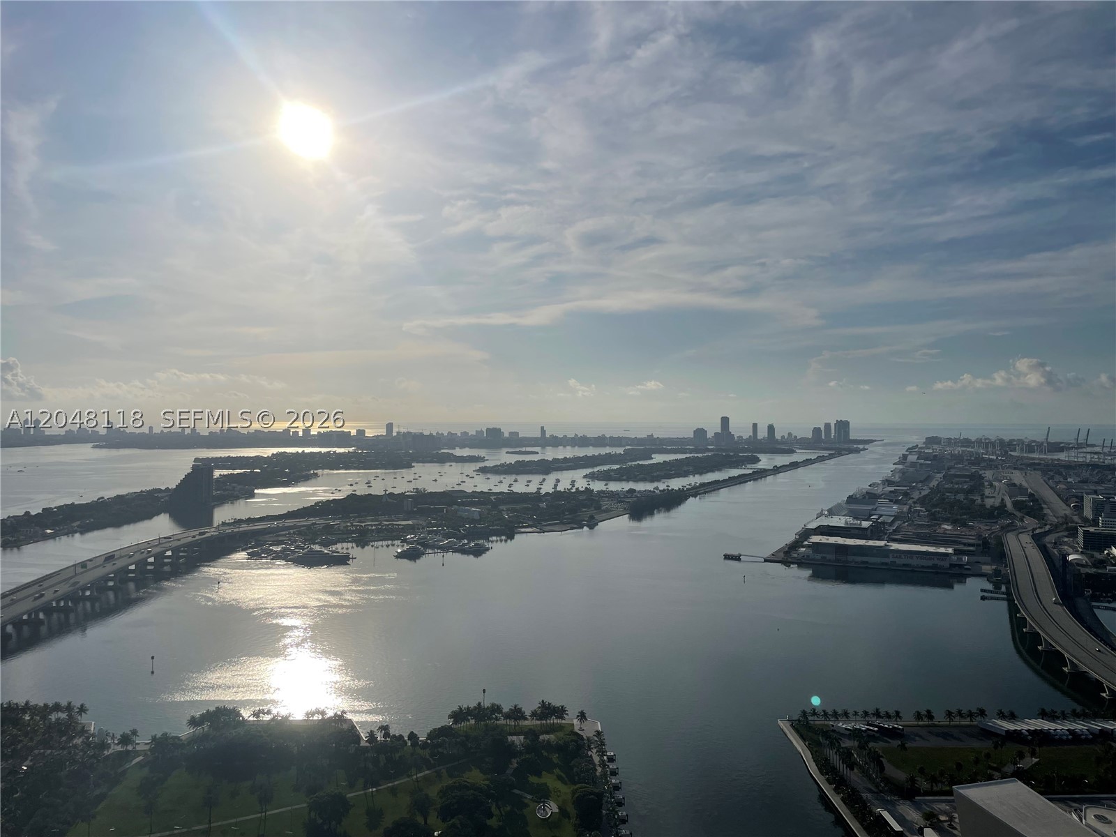 Perched on the 55th floor of 900 Biscayne Bay, this exceptional 1-bed +den/2 bath residence offers an unparalleled blend of luxury, design, and breathtaking panoramic views. Floor-to-ceiling impact glass showcases sweeping vistas of Biscayne Bay, Miami Beach, the Atlantic Ocean, Fisher Island and  PortMiami.
This floor plan features an open-concept living and dining area that flows seamlessly into a contemporary chef's kitchen with premium appliances.
The terrace invites you to experience spectacular sunrises, sparkling city lights, and the constant parade of yachts and cruise ships.
The spacious bedroom is a private sanctuary featuring floor-to-ceiling windows with incredible water views, custom walk-in closet, and a spa-inspired bathroom with dual vanities, a soaking tub, and a glass-enclosed shower. 
Residents of 900 Biscayne Bay enjoy world-class amenities, including two resort-style swimming pools, a state-of-the-art fitness center, spa with sauna and steam rooms, theater, club room, children's playroom, business center, 24-hour concierge, valet, and security.
Located directly across from Museum Park and just moments from the Adrienne Arsht Center, Kaseya Center, the Pérez Art Museum, Frost Museum of Science, Miami Worldcenter, Brickell, Wynwood, and the Design District, this residence offers the very best of Miami's luxury waterfront lifestyle.
Luxury, location, and spectacular views come together in one of Miami's premier full-service condominium residences.