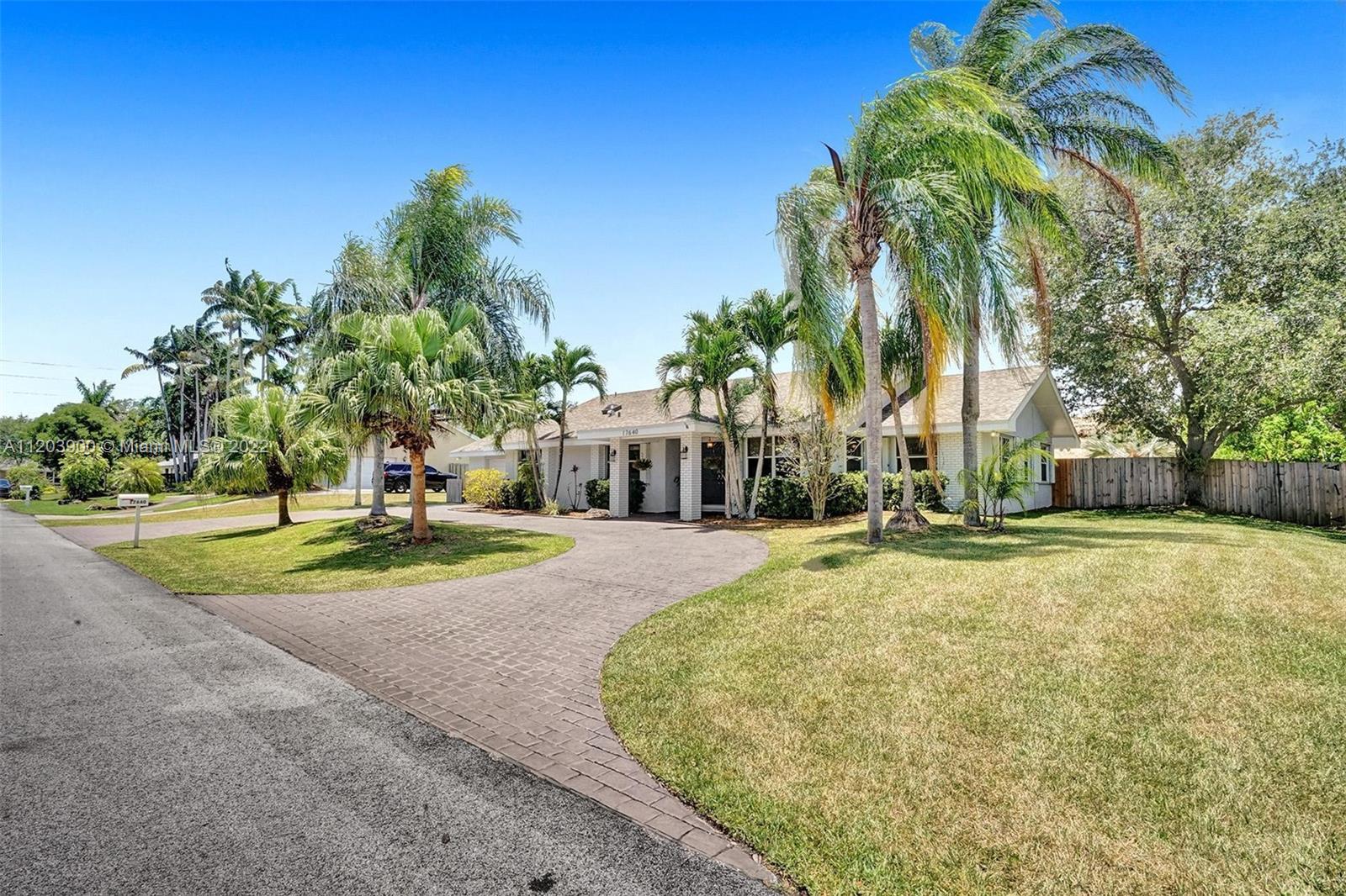 IMAGINE relaxing poolside with family and friends under a newly thatched chickee or cooling off all weekend long in your resort-style backyard pool. Live the lifestyle that everyone dreams of in this lovely fully-custom, 4-bedroom, 2-bath, 2-car garage spacious Palmetto Bay ranch style home. The updated maple cabinetry kitchen is designed to be the heart of the home, which opens into the great room with vaulted ceilings. The kitchen is complete with a pantry, pull-out shelving, granite, and black appliances to include a chef’s double wall oven. The great room surrounds a candle lit fireplace adorned by a coral stone mantle and wall which serves as the centerpiece. The 17,875 sq. ft. lot offers ample room to park an RV or a boat. Within minutes of Black Point Marina & beautiful parks.
