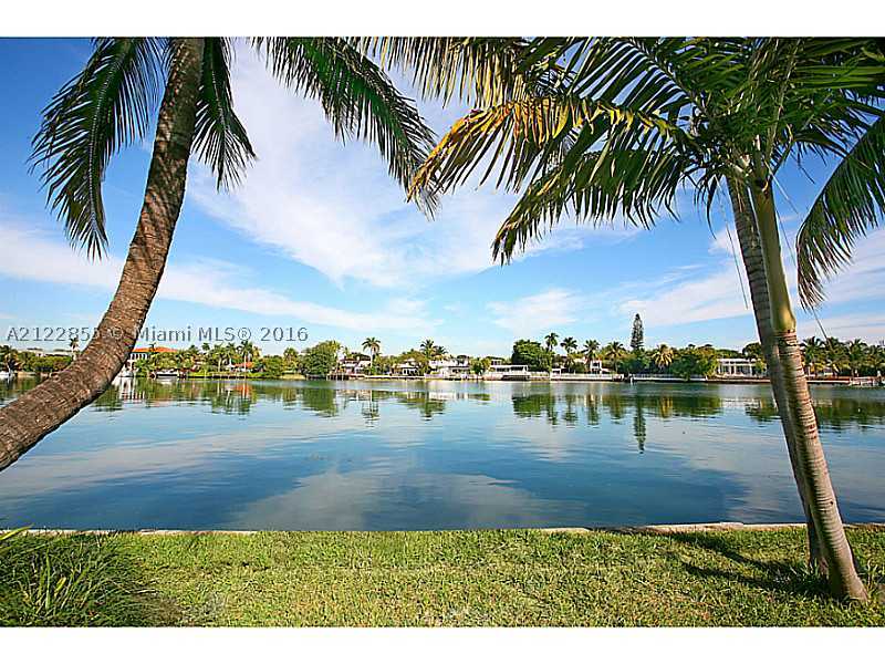 Completely renovated and perfectly laid out home with magnificent wide water views offering 4 large en-suite bedrooms plus spacious attached guest apartment. Classically decorated using timeless finishes such as carrara and black savoie marble countertops, dark oak wide plank flooring and stunning vein cut unpolished marble tiling. Features include large master terrace, multi-room audio system, lutron lighting, poolside cabana bathroom, 2-car garage, and a dock. Great central location.