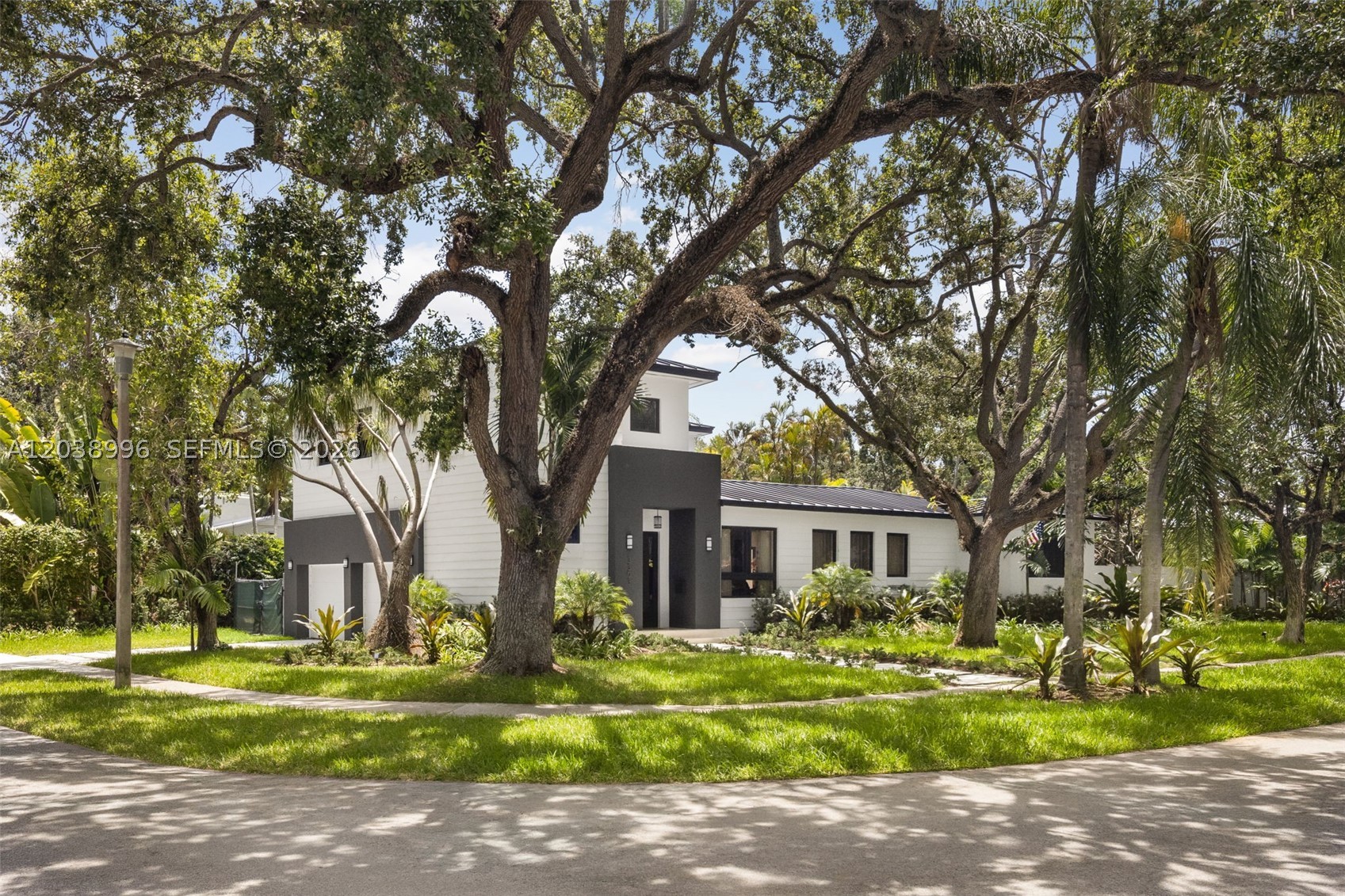 A beautifully crafted residence in North Coconut Grove, set on a spacious corner lot and thoughtfully designed for elevated everyday living. Expansive sliding glass doors blur the line between indoors and out, creating a bright, open atmosphere and seamless flow to the surrounding outdoor spaces. At the heart of the home, the chef’s kitchen is both functional and inviting, featuring a striking T-shaped island ideal for entertaining, abundant storage, and premium Thermador appliances. The spacious primary suite serves as a private retreat, complete with a custom walk-in closet with built-ins and a luxurious spa-inspired bathroom featuring a freestanding soaking tub, oversized shower, and refined finishes. Built with quality and longevity in mind, the residence includes an aluminum roof, impact windows and doors, and a two-car garage with a dedicated storage room and EV charger. Ideally located in one of Miami’s most sought-after neighborhoods, this exceptional home offers the perfect blend of timeless design, modern comfort, and the relaxed lifestyle that defines North Coconut Grove.