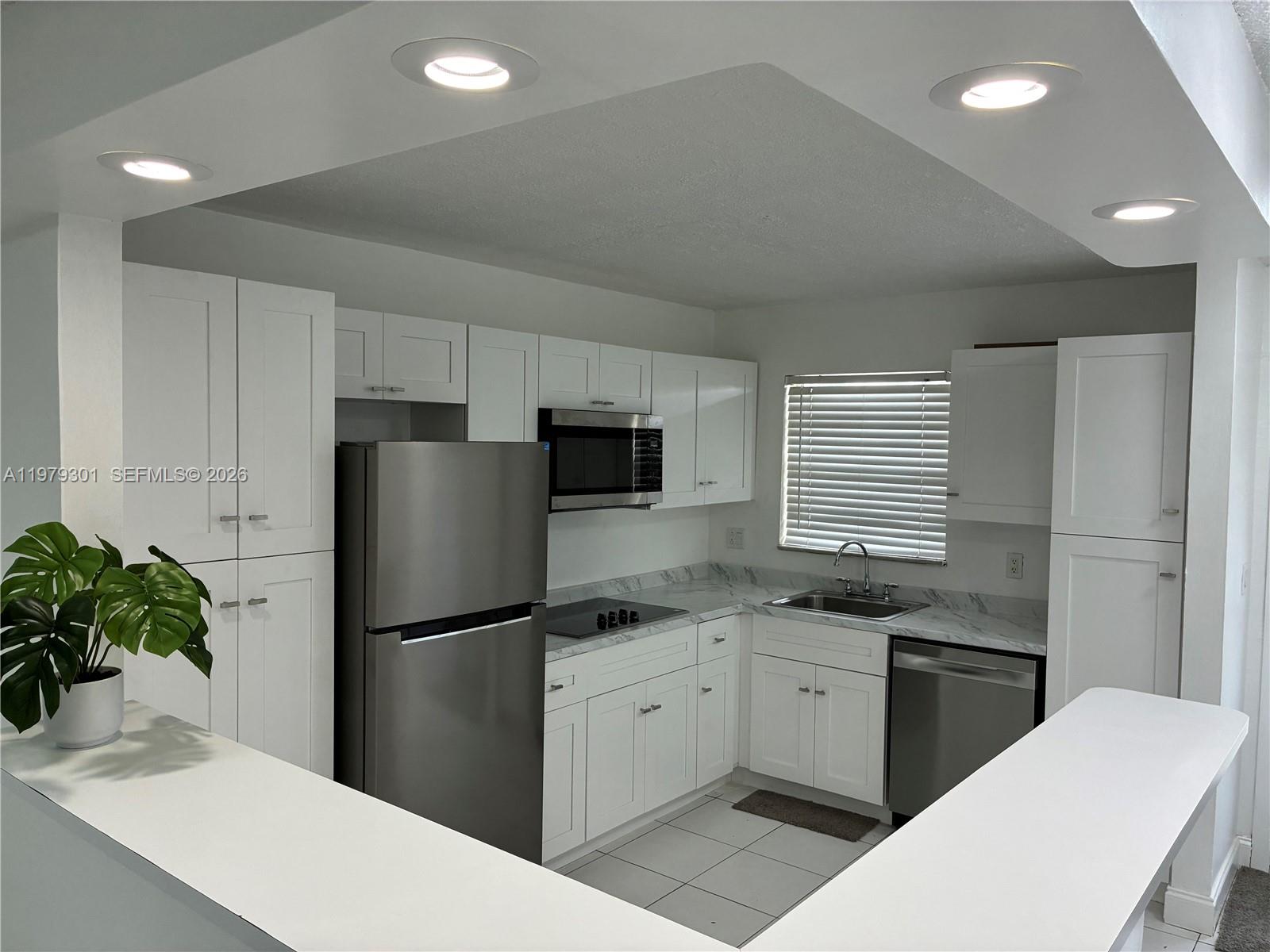 Stop your search—this is the one. Completely reimagined for the discerning buyer, this 55+ oasis is 100% move-in ready. Featuring a gorgeous open kitchen with never-before-used appliances and brand-new flooring throughout, every inch of this home radiates quality. It’s fresh, it’s modern, and it’s waiting for its very first resident post-renovation. Enjoy the best of South Florida living in a friendly, active community close to everything Margate has to offer. Units of this caliber are rare, and one where everything is literally new is unheard of. Schedule your private tour today and experience the "wow" factor in person!