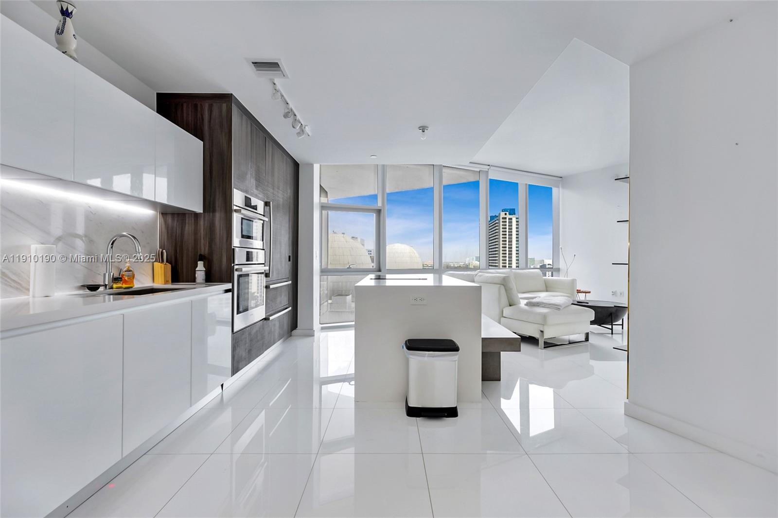 Perfect location in the Hard Downtown Miami World Center. HIGH CEILINGS 10' WITH FLOOR-TO-CEILING WINDOWS, ITALIAN KITCHEN AND TOP OF THE LINE APPLIANCES BOSH MARBLE FLOOR. Most Amenities in the World, including a basketball court, 5 pools, Spa, Gym with boxing area, BBQ kitchen, virtual golf, recording studio, Racquetball, Yoga, Sunrise pool, & kids' play area. Skydeck, Observatory to view stars with telescopes, Tennis courts, and a Jacuzzi. Tenant-occupied lease ends March 2027. Read broker remarks.
