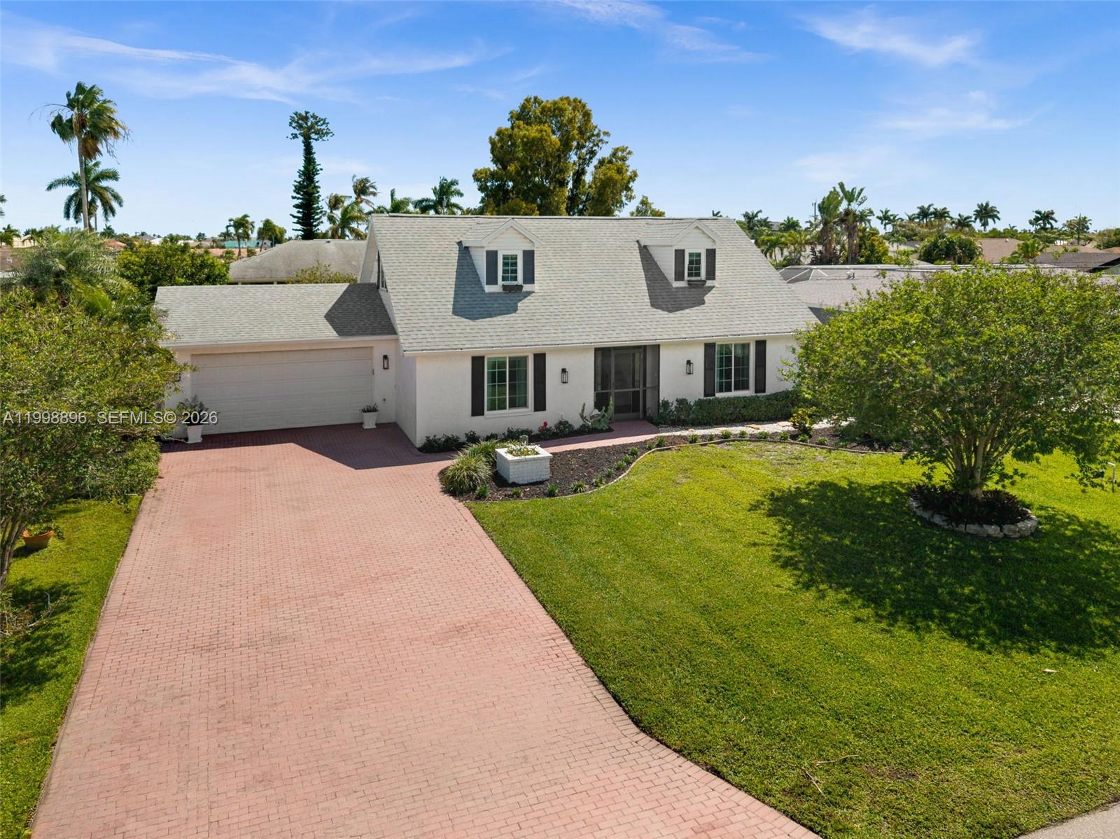 DISTINCTIVE CAPE COD STYLE HOME IN CAPE CORAL’S SOUGHT AFTER EIGHT LAKES AREA! Welcome to 706 SW 51st Ter, a unique 3-bedroom, 2-bath home offering 1,908 sq ft in one of Southwest Cape Coral’s most desirable neighborhoods. With classic Cape Cod architecture, dormer windows, and inviting curb appeal, this home stands apart from typical Florida-style homes. The remodeled kitchen features quartz countertops, shaker cabinetry, tile backsplash, built-in wine rack, pantry, and breakfast bar open to the family room with French doors to the screened lanai. The primary bedroom is on the main floor, while two upstairs bedrooms feature charming dormer windows. Enjoy a large screened lanai, open patio, oversized yard with room for a pool, laundry room, 2-car garage, and paver driveway. Minutes to Tarpon Point, Cape Harbour, downtown Cape Coral, and Rotary Park.