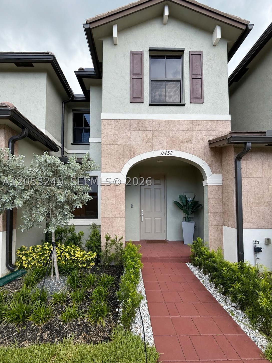 Property is Occupied. Showings by appointment only with a minimum of 24-hour notice. 
Welcome to this beautifully maintained 3-bedroom, 2.5-bath townhome located in the highly sought-after gated community of Aquabella. Built in 2022, this move-in ready home features a bright open-concept layout with tile flooring on the first level and upgraded laminate flooring throughout the second floor—no carpet anywhere.

The modern kitchen opens seamlessly to the living and dining areas, creating the perfect space for everyday living and entertaining. Upstairs, you'll find spacious bedrooms, including a comfortable primary suite with walk-in closet and ensuite bath.

Step outside to your private backyard featuring a fully permitted pergola, providing the ideal setting for outdoor dining, relaxing, or entertaining guests. The fenced patio offers privacy and low-maintenance living.

Aquabella residents enjoy resort-style amenities including two clubhouses, two swimming pools, a jacuzzi, two fitness centers, children's splash park, playground, business center, game room, and event room. Conveniently located near major highways including I-75, the Florida Turnpike, and SR-826, with easy access to shopping, dining, schools, and everyday conveniences.

Don't miss this opportunity to own a beautifully upgraded home in one of Hialeah's most desirable communities. 
Showings: Monday through Friday: 9:00 AM – 5:00 PM Saturday & Sunday: 2:00 PM – 5:00 PM