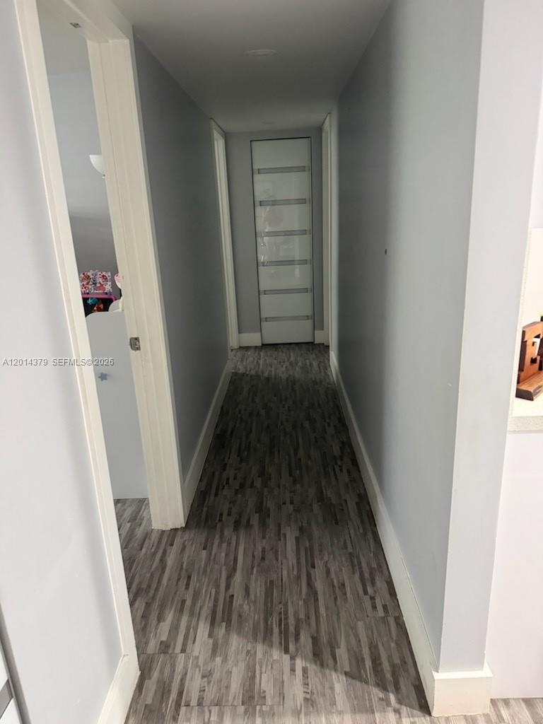 UNAPPROVED SHORTSALE Two bedroom two bath. Updated bathroom and floors. Balconies were eliminated, to gain more space in the living room and one bedroom, two assigned parking and additional parking for guest, parking area is gated a control remote is needed to gain access. The apartment has in laundry area, stove, microwave and refrigerator.  Is located ,on the second floor. Building has a pool, elevators, building has 6 floors, you will need to apply for the condominium association. CASH ONLY. NO ASSIGNABILITY.