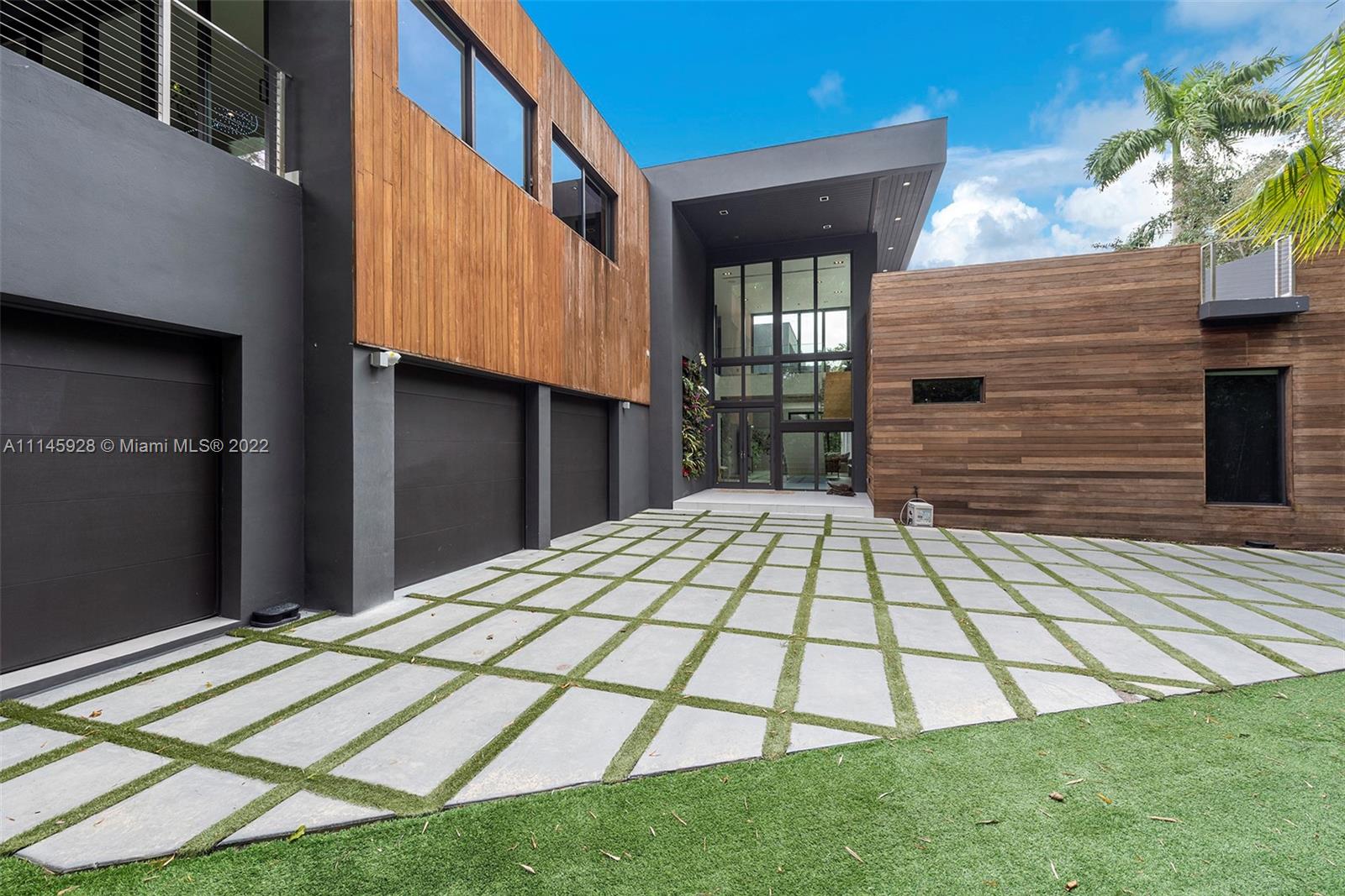 Set in the heart of Coconut Grove and completed in 2017, this modern masterpiece has it all. Oversized entertaining areas, an abundance of natural light, volume ceilings and modern luxuries abound in this 6 bed, 6/2 bath jewel. The newly updated kitchen is an epicurean dream with cooking island, top of the line appliances, and ample but well hidden storage areas. Entertain your guests indoors or outside by the lap pool, outdoor kitchen and covered terrace. Enjoy a tranquil setting while being walking distance from some of the best schools, shops and restaurants in Miami. Priced to sell!
