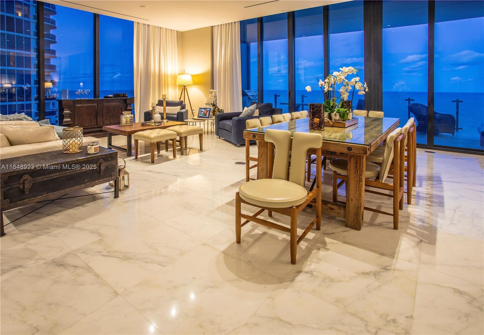 Spectacular Oceanfront Residence in Prestigious Sunny Isles

Welcome to your private paradise — an elegant 3-bedroom, 4-bathroom oceanfront residence located in one of Sunny Isles Beach's most exclusive luxury high-rises. This expansive home seamlessly blends high-end design, world-class amenities, and breathtaking views of the Atlantic Ocean.

As you enter through a private elevator foyer, you’re greeted by floor-to-ceiling glass walls that frame panoramic ocean view, flooding the space with natural light. The open-concept living and dining area, custom lighting, and sleek architectural details.