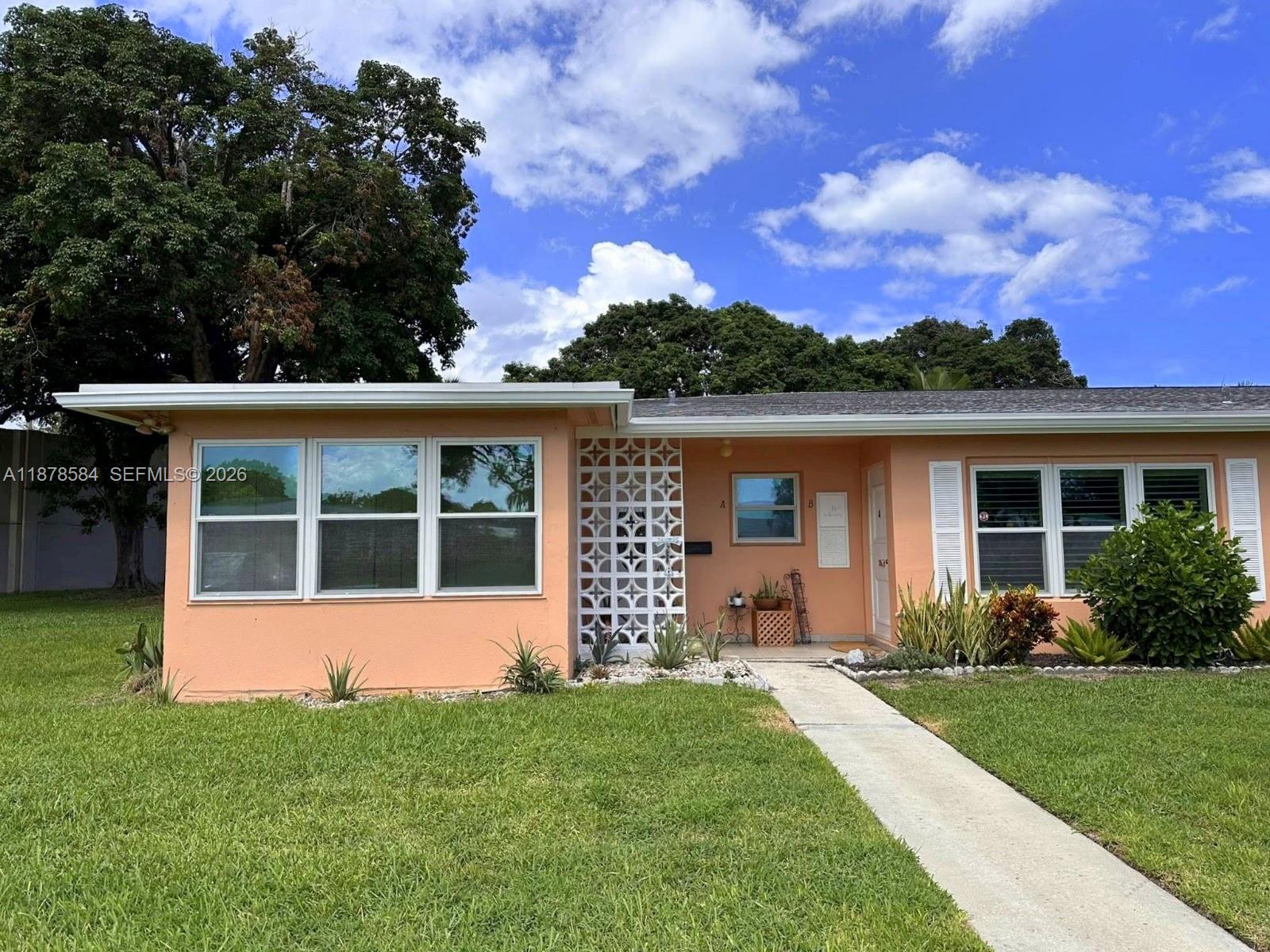 Discover easy, vibrant living in this charming 2-bedroom, 2-bath corner villa surrounded by expansive green space, located in the desirable High Point 55+ community. This well-maintained home offers both comfort and peace of mind, featuring a new roof (2023), fresh exterior paint (2024), and updated asphalt driveway and roads (2021). Hurricane impact windows provide added security and energy efficiency.
Inside, you’ll find tile flooring throughout the main living areas for a clean, low-maintenance lifestyle, along with ceiling fans in every room to keep things cool year-round. The spacious Florida room has been thoughtfully converted into a bright sunroom—perfect for relaxing, entertaining, or enjoying your morning coffee.
High Point is known for its active adult lifestyle and welcoming atmosphere. Residents enjoy access to two pools with water aerobics, a lively seasonal happy hour, clubhouse activities, volleyball, a putting green, bocce ball courts, and more. Conveniently located near shopping, dining, entertainment, and beautiful beaches, this corner villa offers the ideal blend of leisure and location.
Don’t miss your opportunity to enjoy the best of South Florida living in this inviting home!