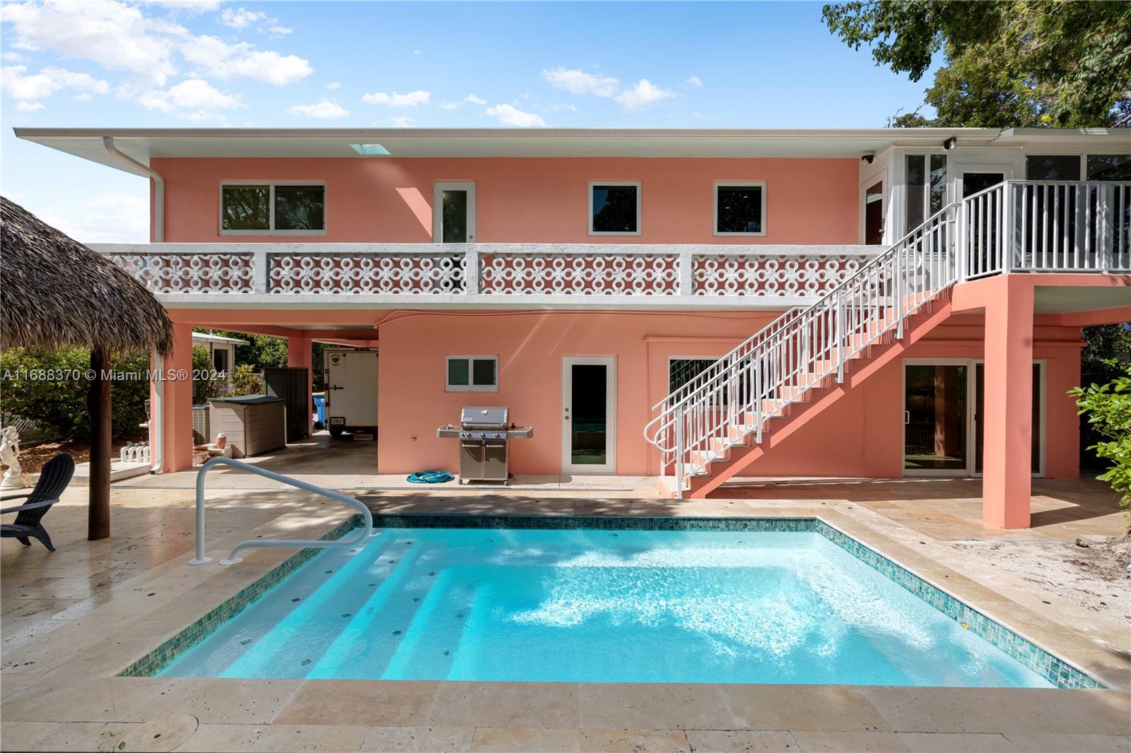 ALL CONCRETE BUNKER in an X Zone, beautifully updated! With 2,200sqft under air, this 3/3 pool home has it all! Located in Islamorada's Plantation Key Colony, on a fully fenced & gated lot & a half in an X zone. The main living area offers vaulted & insulated ceilings & a true chef's kitchen, w/ a full suite of GE Cafe series stainless appliances. Back steps lead to the new heated & chilled in ground pool w/ jets & water fall, surrounded by travertine pavers & a new tiki with electric. Upgrades incl impact windows, new electrical throughout incl. underground service; new plumbing, LED lighting, all new HVAC & more! Join Plantation Key Colony's voluntary HOA (just $250 per year) to access private bayfront homeowner's park, beach, truck & trailer parking & boat ramp is just down the street.