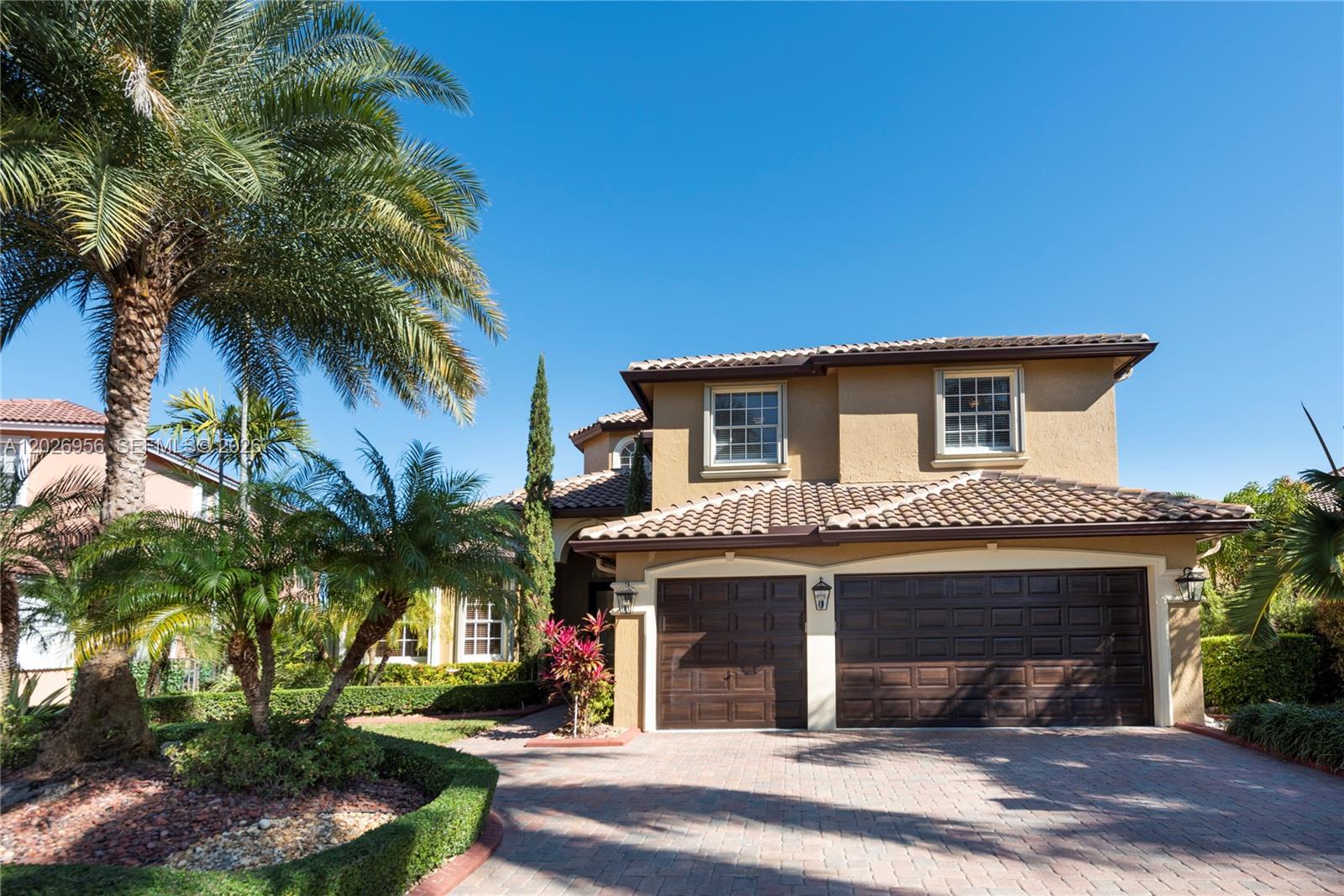 Exceptional lakefront residence on an oversized premium lot in one of Miramar’s most sought-after communities, offering breathtaking unobstructed water views and an ideal layout for multigenerational living. This spacious home features 6 bedrooms, 5 bathrooms, and a 3-car garage, including a first-floor bedroom and full bath plus a versatile office with cabana bath that can easily function as an additional bedroom. The expansive primary suite showcases a private balcony overlooking the lake, creating the perfect retreat. Interior spaces are filled with natural light, soaring ceilings, and comfortable living areas designed for both everyday living and entertaining. The kitchen flows seamlessly into the family room and offers abundant cabinetry and workspace. Newer roof (approximately 4 years old) provides added peace of mind. Outdoor living is elevated with a heated saltwater pool, screened enclosure, fenced yard, and generous waterfront patio spaces ideal for entertaining year-round. Additional features include EV charging station, whole-home cabling, surround sound, and poolside AV setup. Residents enjoy resort-style amenities including clubhouse, fitness center, pool, kids splash area, tennis, basketball, soccer, sand volleyball, aerobics studio, ballroom, and more. Prime location just minutes from Miami and Fort Lauderdale airports, major highways, premier shopping, dining, and entertainment.