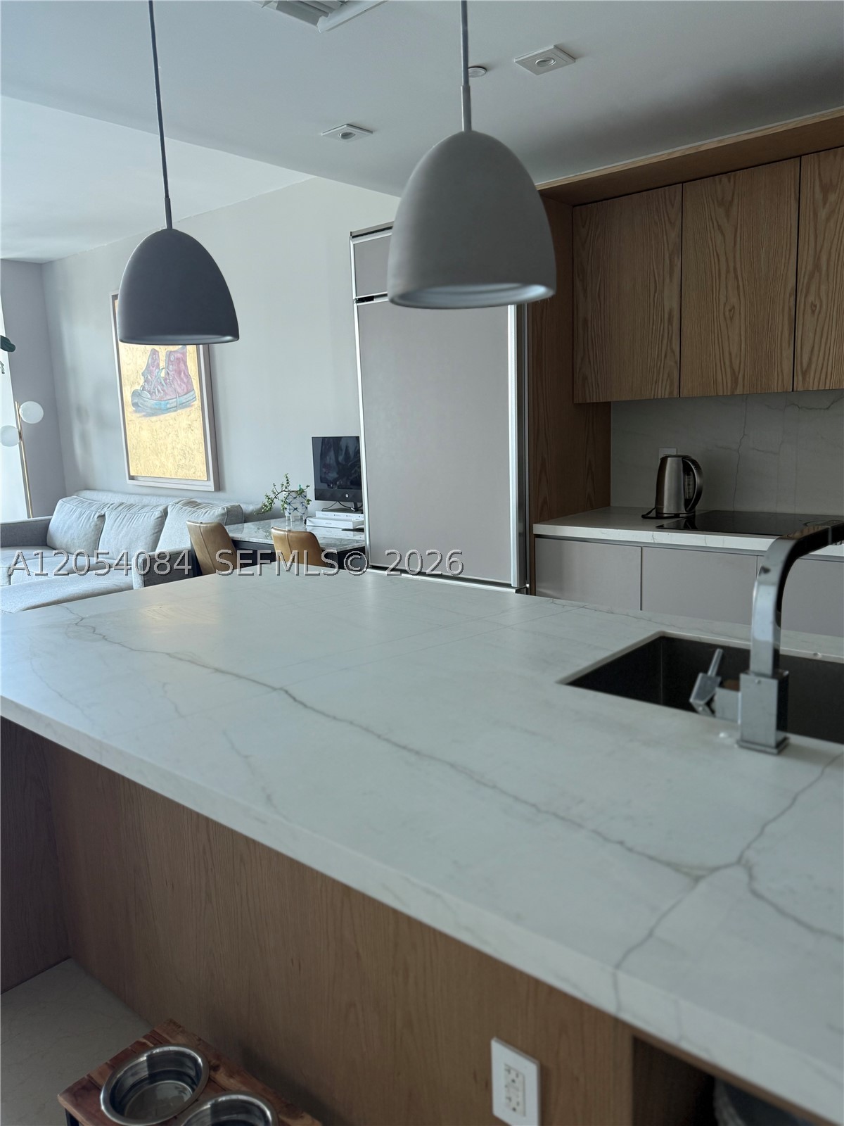 Direct water view remodeled unit, open space and bright. This two bedroom two bath with direct water views. Big island perfect for entertaining, one garage space private unit foyer.  Two Tennis courts, gym, spa.