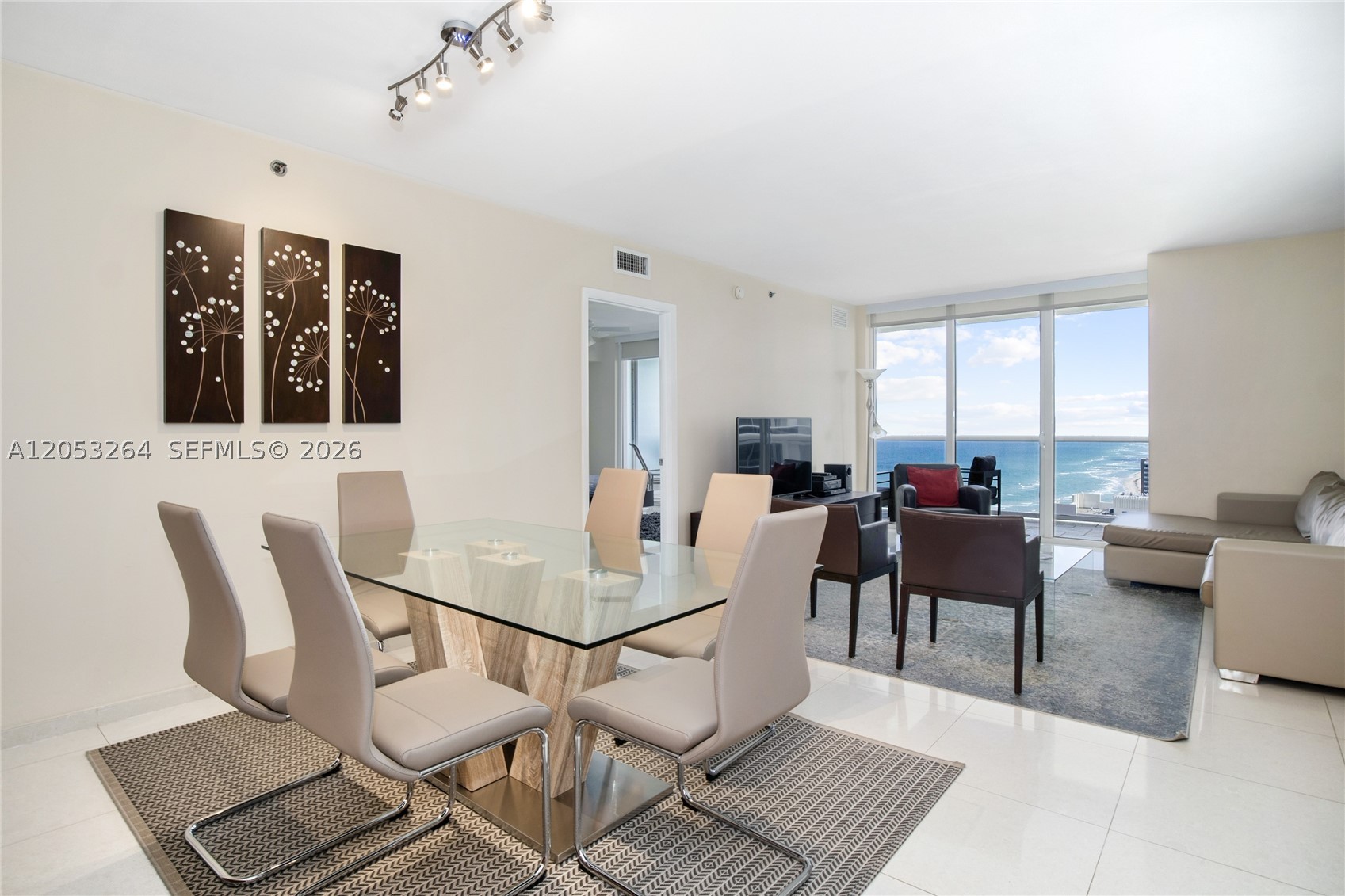 Stunning fully furnished residence offering breathtaking ocean and Intracoastal views with desirable southeast exposure. This elegant home features 2 bedrooms, an enclosed den, and 3 full bathrooms. The spacious primary suite includes a luxurious Jacuzzi tub. The residence showcases a European-style kitchen with granite countertops, custom cabinetry, and marble flooring throughout. Beautifully appointed with high-end furnishings, the unit includes a king-size bed in the primary bedroom, a queen bed in the second bedroom, and twin beds in the den, offering both comfort and sophistication. An exceptional opportunity to own a luxurious beachfront residence in one of the area's most sought-after oceanfront communities.