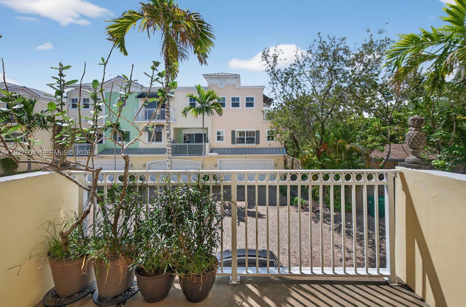 Move-in ready 3/3.5 tri-level townhome in prime Fort Lauderdale location, minutes from downtown, Las Olas, beaches, shopping, dining, airport, I-95 and I-595. Bright and spacious with crown molding, updated flooring and NO CARPET. First-level bedroom with full bath is perfect for in-laws, teens, guest or a private office.  Each bedroom has its own bathroom.  Features include a 2-car garage with 4 total parking spaces, large kitchen with stainless steel appliances, wood cabinetry, granite countertops and breakfast bar, plus a spacious balcony for outdoor dining.  Spacious primary suite offers a walk-in closet, private balcony, Roman tub, and separate shower. Walking distance to A+++ elementary school.  HOA includes exterior insurance, property & building maintenance.