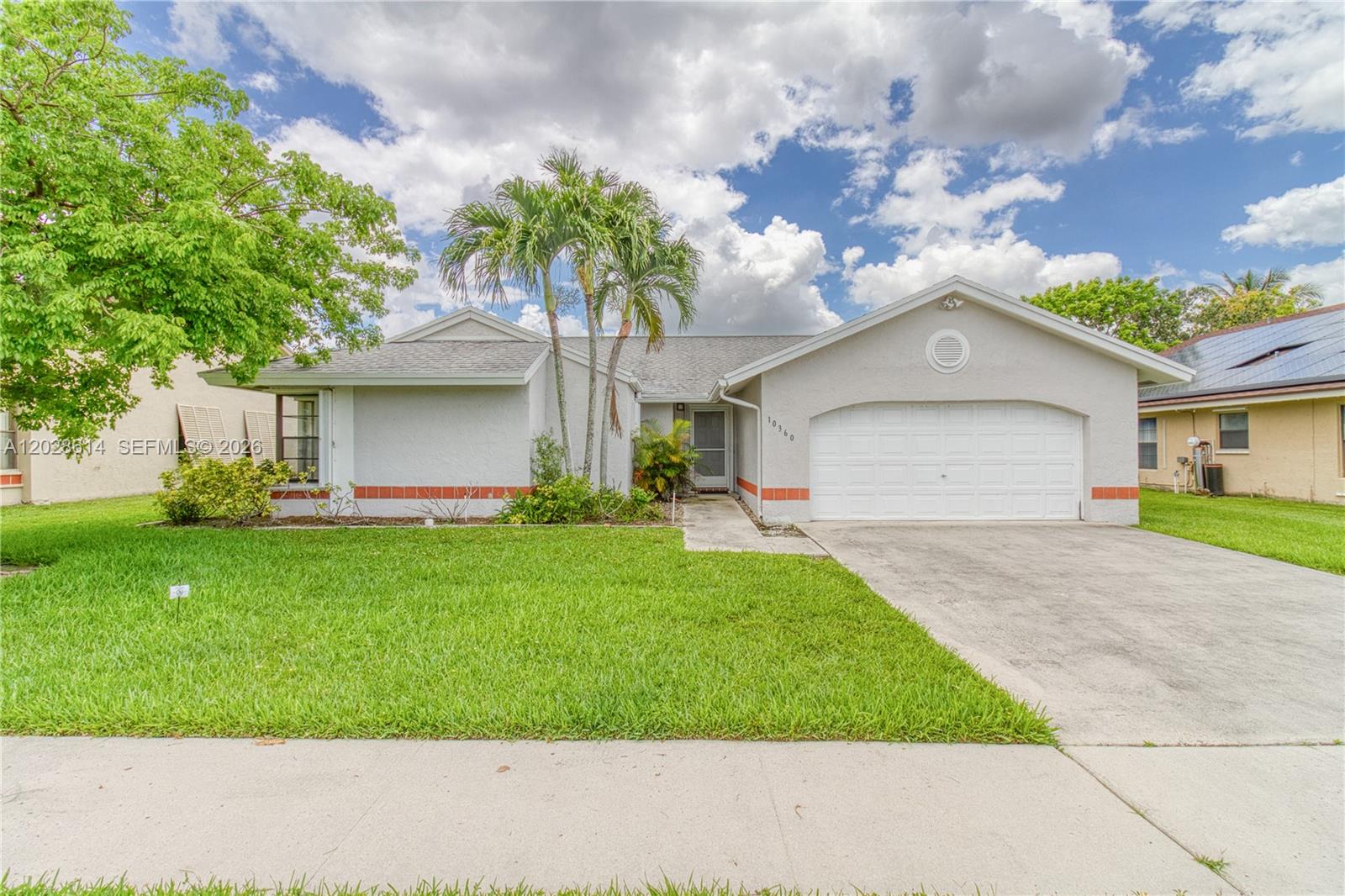 Spacious 3-bedroom, 2-bath home in the desirable Welleby section of Sunrise. This light-filled home features a functional layout, vaulted ceilings, and a primary bedroom with walk-in closets and an en-suite bath. The large screened-in patio is fantastic for entertaining or relaxing after a long day. Other standout features include a 2024 AC system, a 2-car garage, and accordion shutters. Current taxes are only $310/YEAR due to exemptions. Located within a well-established community near parks, shopping, dining, and major commuter routes, this home combines convenience, comfort, and a sought-after neighborhood setting.