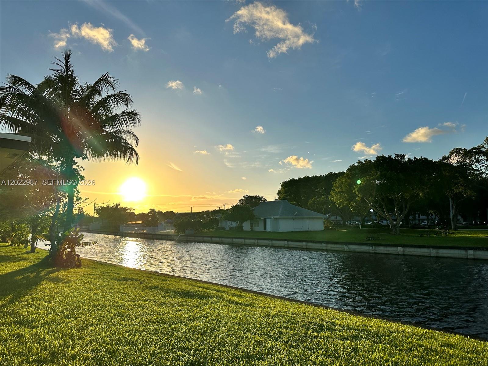 Single-family home in the Sunset Isles Section of the Mainlands with a breathtaking waterview. This is a 2-bedroom, 1-bath home on a canal with room for 3 cars in the driveway. Home is extremely spacious and well-kept. Fully tiled throughout the home and painted in sweet colors in all the rooms. Frigidaire appliances in the kitchen. Nice-sized laundry room. The roof was installed in 2020, and A/C in 2022. No restrictions on pets and motorcycles. This is an active adult community. Walking distance to clubhouse, and close to shops, restaurants, and major highways. Maintenance covers lawn service, sprinklers, painting every 5 years, and pressure cleaning of roof.
****Ask me about Lender-paid 1-0 Rate Buydown for one year, along with FREE Credit report and new Vantage vs Fico credit scoring. Good until the end of June 2026. Vantage scoring is helping many buyers get better rates on their loans***