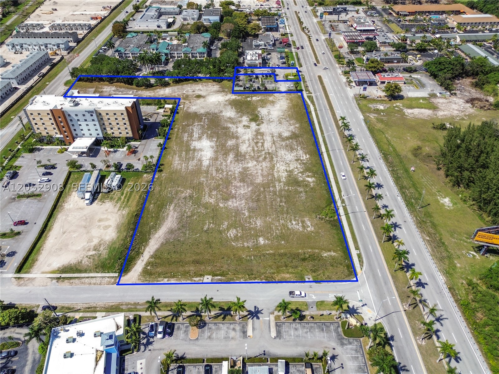 Rare opportunity to own 4.98 acres of vacant industrial-zoned land with high visibility frontage on both US-1 and Krome Avenue. Surrounded by major hotel chains, restaurants, and gas stations, this parcel sits in the heart of rapidly growing Florida City- just before iconic stretch into the Florida Keys. This is one of the last vacant parcels offering unparalleled development potential for logistics, warehousing, hospitality, or mixed use commercial projects. With high traffic counts and easy access to major highways, this location is ideal for investors and developers seeking prime real estate in growth corridor. Located in between the Best Western and Fairfield Inn by Marriott, next to the Pollo Tropical, and across the street from McDonald's and Exxon Gas Station.