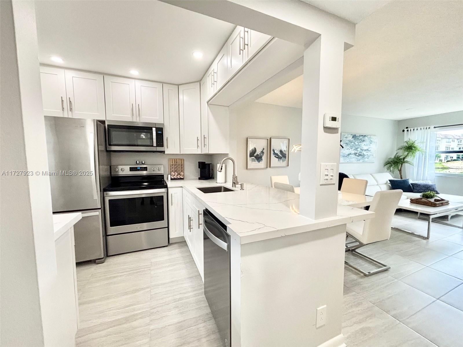 Get ready to say "WOW"! This beautiful 1st-floor condo offers stunning water views that will take your breath away every day! The bright and open kitchen features sleek white cabinetry, elegant quartz countertops, and top-of-the-line stainless steel appliances, perfect for creating culinary masterpieces. The upgraded bathroom adds a touch of luxury, and the Florida room is a true gem—ideal for relaxation and entertaining guests, with a cozy den and a sofa bed for extra accommodations. The large bedroom includes a walk-in closet & offers a peaceful atmosphere. The high-impact windows in this home is a combination of comfort and security. Located in a peaceful 55+ community with low HOA fees, it’s the perfect retreat to enjoy serene living and the beauty of nature. Hurry!