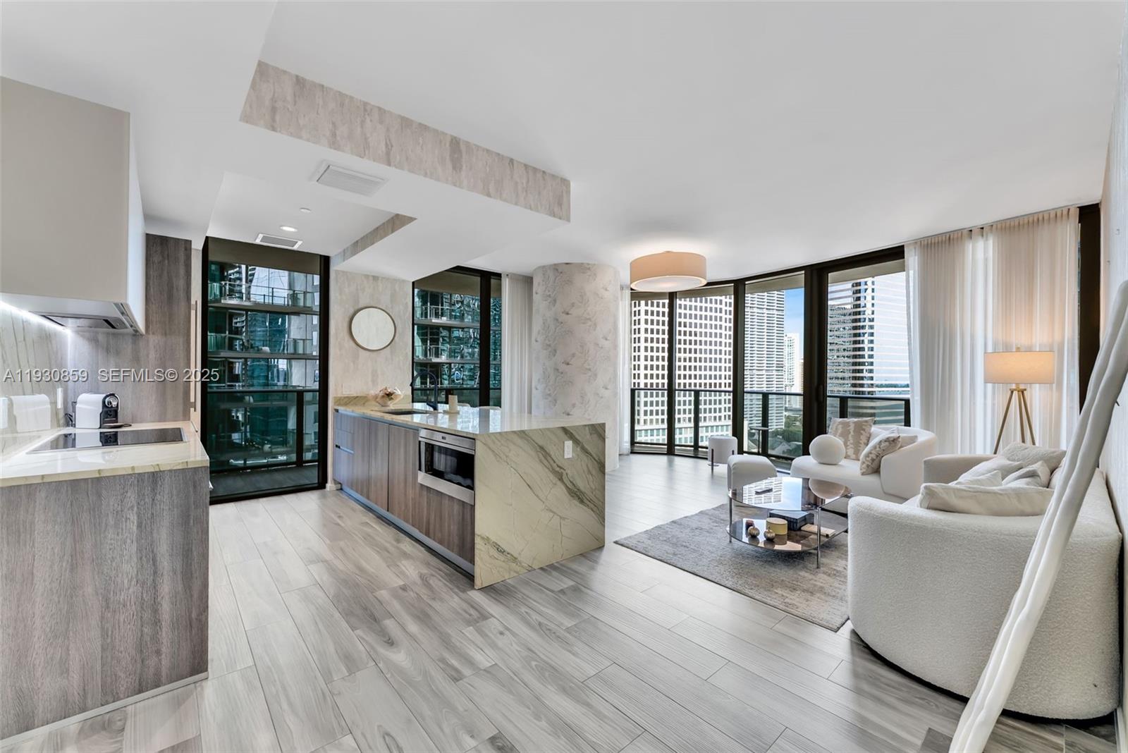 Enjoy bay and Miami skyline views from the wrap-around balcony of this newly updated 2 Bed, 2 Bath corner unit at the SLS Lux in Brickell. The unit features a private elevator with biometrics technology, fully upgraded penthouse-like kitchen, wood-like porcelain floors, finished walk-in master closet, large master bathroom with a double sink, rain shower and a separated tub. Modern drop ceilings with recessed lighting and LED accent This building offers high-end amenities including a residential only roof top pool, residential only indoor lounge with a private wine cellar, several lounge areas, a SPA with a relaxation area and three treatment rooms, fully equipped gym, kids’ room, full service pool and cabana lounge, pool and poker tables, tennis court, 24/7 concierge service and valet.
