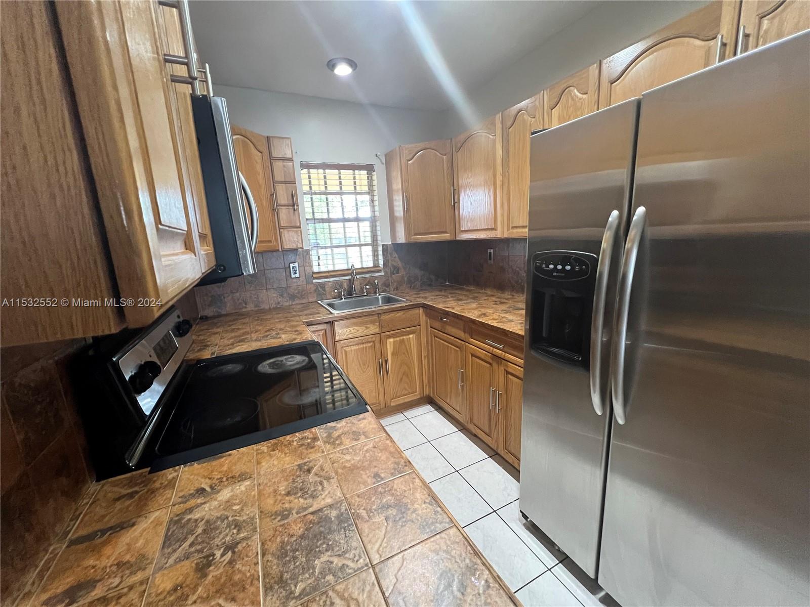 Updated 2 bedroom one bath condo for rent in central location. Spacious living area, large bedroom, all tile (no carpets), central AC, lots of natural light, 2 assigned parking spaces, professionally cleaned, painted.
