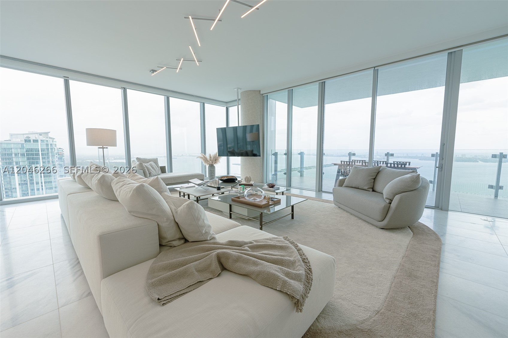 Completely furnished by Artefacto and professionally decorated 4 bedroom apartment at
Missoni Baia condominium. Brand new construction boasting direct ocean views with floor to
ceiling windows from every room. The gourmet kitchen, adorned with premium finishes, is
equipped with state-of-the-art stainless steel appliances. The master suite is a sanctuary
of tranquility, featuring a king-sized bed and a private sitting area. The master bathroom
offers a spa-like oasis with luxurious amenities including separate shower and bath tub.
Three additional bedrooms including staff bedroom provide comfortable accommodations with
complete decorator furnishing. All rooms have black outs and shades. Fully equipped with
smart home technology, outdoor designer furnished terrace, 2 parking spaces included