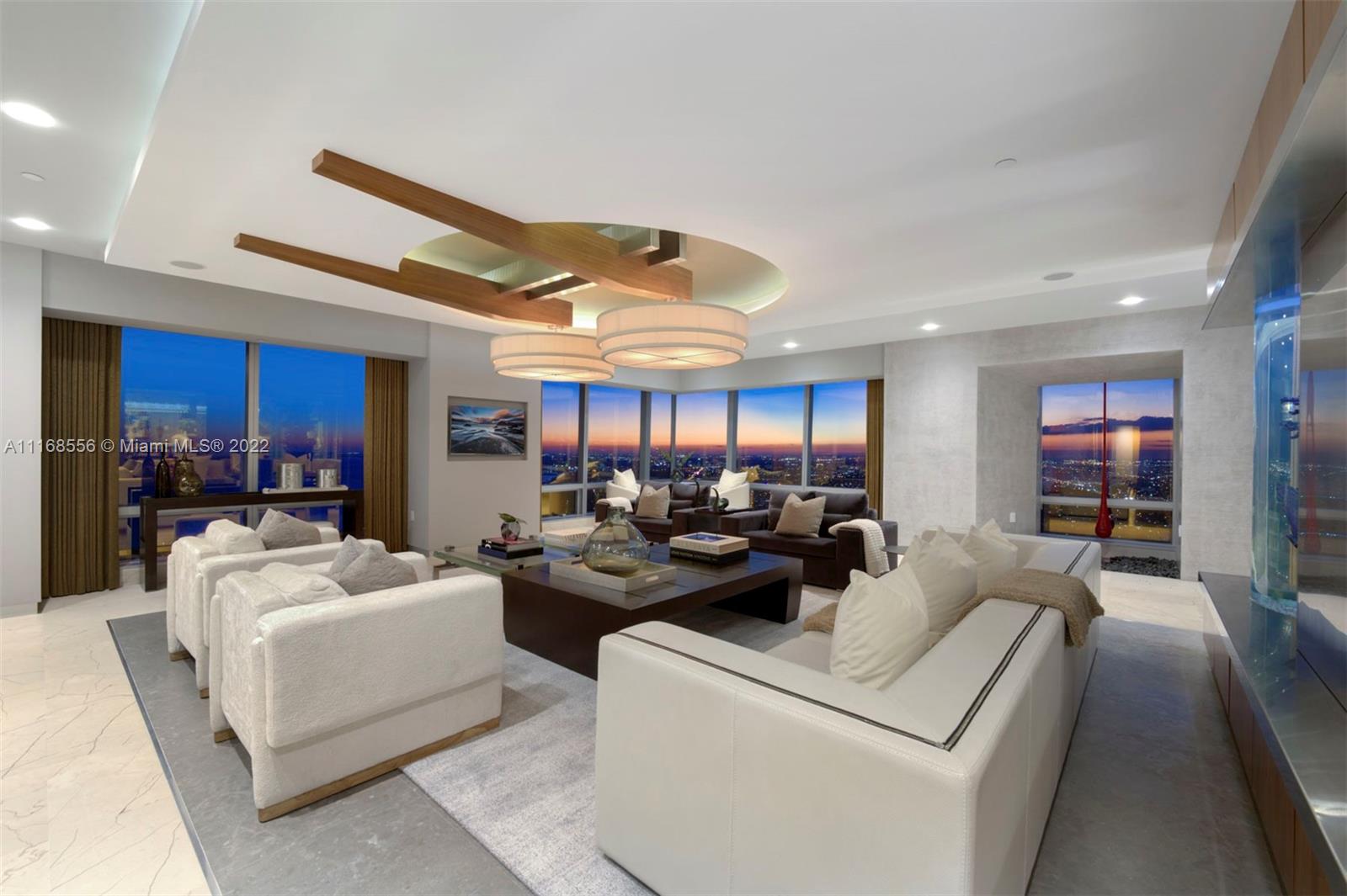 Crown jewel PH soaring 68 stories in the sky at the world renowned Four Seasons in the heart of Miami’s financial district. Encompassing 4 combined units, bright turquoise waters & powder blue skies envelop this stunningly transformed 7,438 SF residence. Walk in through an impressive private foyer w/an imposing steel & glass entry door to floor-to-ceiling windows showcasing sweeping unobstructed views of the bay, ocean, city & breathtaking sunrises/sunsets. Boasting 3 spacious bedrooms w/walk-in closets, en-suite bathrooms, private movie theatre, formal dining area, chef’s kitchen w/slab stone marble countertops, wine cellar, aquarium & board room. Designed by renowned architectural firm ODP. Sold fully furnished & move-in ready. Enjoy quintessential Four Seasons luxury amenities.