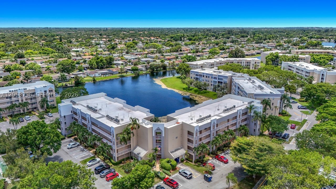 Welcome to this beautifully updated 2-bed/2-bath condo in Sunrise Lakes Phase 4, offering a bright split-floor design perfect for privacy and comfort. The modern kitchen features quartz counters, plenty of storage, and stainless-steel appliances. A spacious laundry room with washer/dryer and extra closets adds everyday convenience. Step onto the screened balcony for tranquil views or take a short stroll to the pool for effortless relaxation. A wonderful opportunity to enjoy the Sunrise Lakes lifestyle.