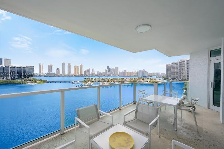 This lovely luxury waterfront residence at The Peninsula showcases breathtaking intracoastal views and refined living at its finest. Enter directly into your private foyer through elegant double doors creating an immediate sense of exclusivity. Spanning over 2,900 sf, this expansive residence features a spacious den perfect for a media room, office or add'l lounge area.  The principal suite is generously sized w/a private suite is generously sized with a private sitting area, rich wood flooring, oversized closets, and a large principal bath with a sep. shower and tub. The second bedroom is equally spacious.  The well appointed kitchen is exceptionally spacious and offers multiple layouts with the add'l space for a den or a formal dining area.  Exceptional services include a concierge, fabulous staff, 2 resort pools and hottubs, barbecue areas, a basketball area, 2 playrooms for diff. ages, multi purpose rooms, comp. daily coffee, tennis & pickleball, a dog park, and much more.  Resort living at its finest!!