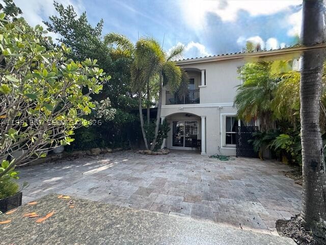 Waterfront 3BR/2.5BA corner townhouse with private dock in gated Harbor Islands! Enjoy ocean access with no fixed bridges and space for up to a 45 ft boat. This well-maintained 2-story home with high ceilings, a bright open layout, and spacious living areas. The kitchen flows into the living/dining space, great for entertaining. Ground floor includes an extra room for office or guest use. Private patio with lush tropical landscaping creates a serene outdoor retreat. Upstairs features 3 bedrooms plus a family room/loft. Primary suite has a balcony with water views and two walk-in closets.  2-car garage. Resort-style amenities.