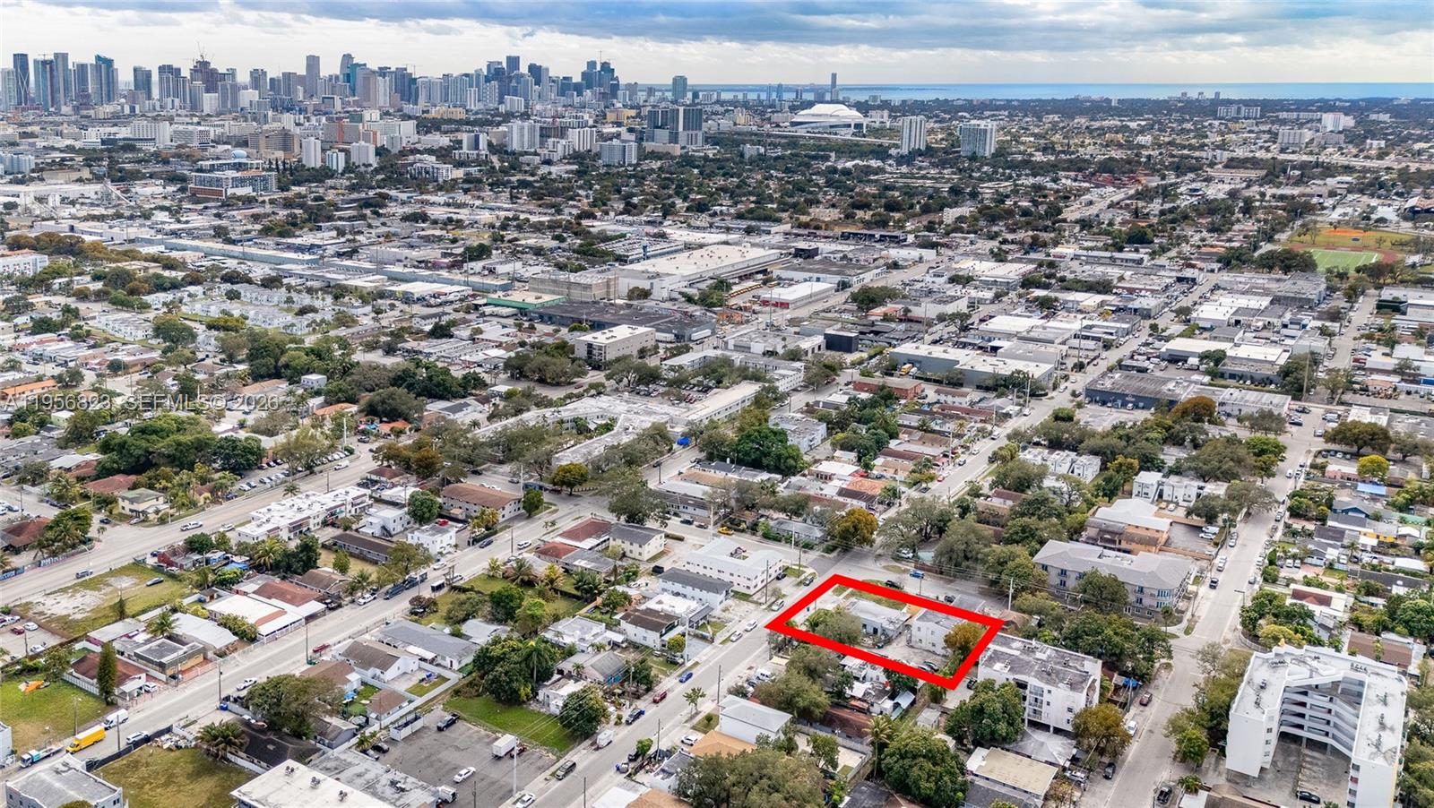 Attention investors and developers! Rare opportunity to acquire two contiguous lots totaling 11,040 square feet in the heart of Allapattah, one of Miami's fastest-growing neighborhoods—portfolio sale includes adjacent land parcel
A11959678   (separate folio) Zoned T4-R and strategically positioned on the NW 27th Avenue corridor, immediately west of the vibrant Wynwood Arts District. The property features an income-producing 5-unit multifamily building with four 1-bedroom/1-bath units plus one spacious 4-bedroom/3-bath unit, all with individual utility meters for water, electricity, and gas to maximize cash flow efficiency. Located in a high-traffic commercial corridor with exceptional growth potential and superior connectivity—just minutes from Wynwood, the Health District, Downtown Miami, and major employment centers, with quick access to SR-836, I-95, and the Airport Expressway. Prime redevelopment opportunity: hold and collect income or capitalize on T4-R zoning for value-add development while the included adjacent lot provides immediate expansion possibilities. Outstanding investment in one of Miami's most rapidly appreciating submarkets.
