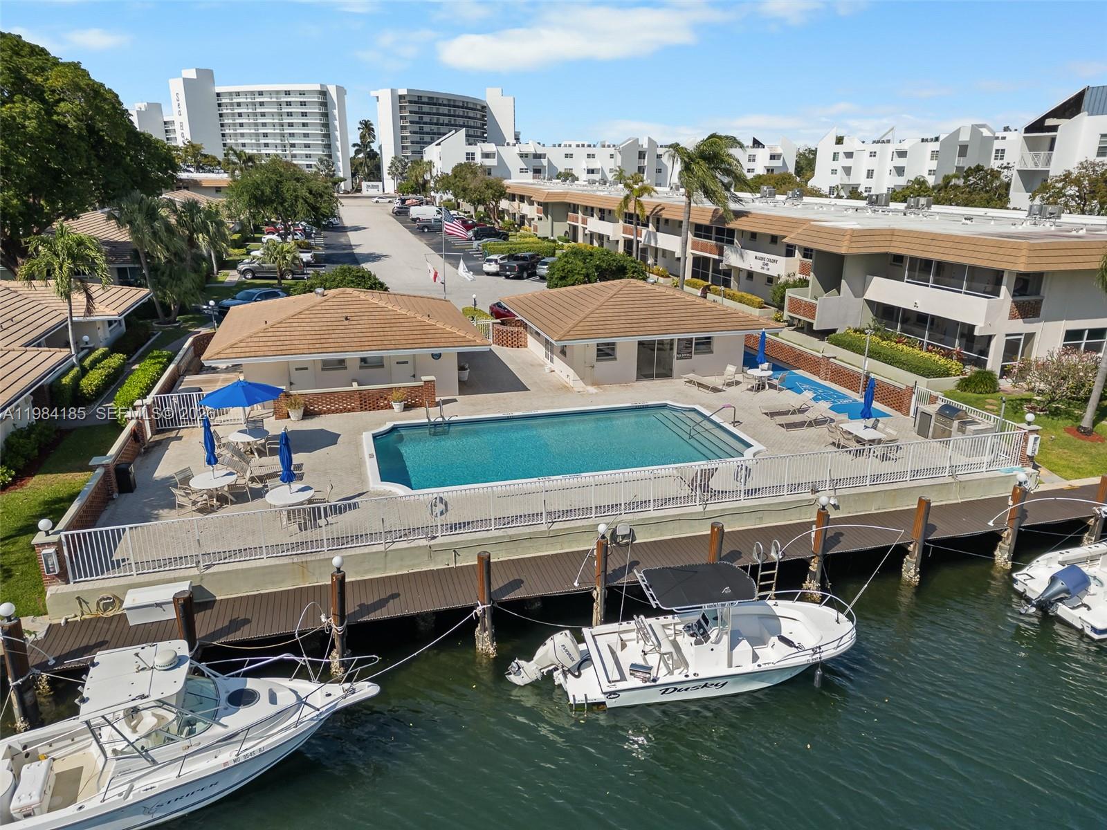 REDUCED TO SELL! Prime Location Condo - Rent Immediately! This spacious 2 bed/2 bath condo is located in an unbeatable waterfront Intracoastal Community of Marine Colony, within walking distance to Pompano Beach! The unit features A NEW ROOF, 2025 A/C, granite kitchen counters, a tankless water heater, and impact windows, with a waterfront clubhouse that includes a year-round heated & chilled pool, a grill island for poolside gatherings, a fitness center, a sauna & boat dockage (when available with no fixed bridges). Pet-friendly, max. of 20 pounds, no age restrictions. Tandem parking/2 cars right in front of the building. There are no mandatory full reserves in 2025, thanks to the low-rise building; 10% down is required by the HOA. SELLER PAID ROOF ASSESSMENT.
