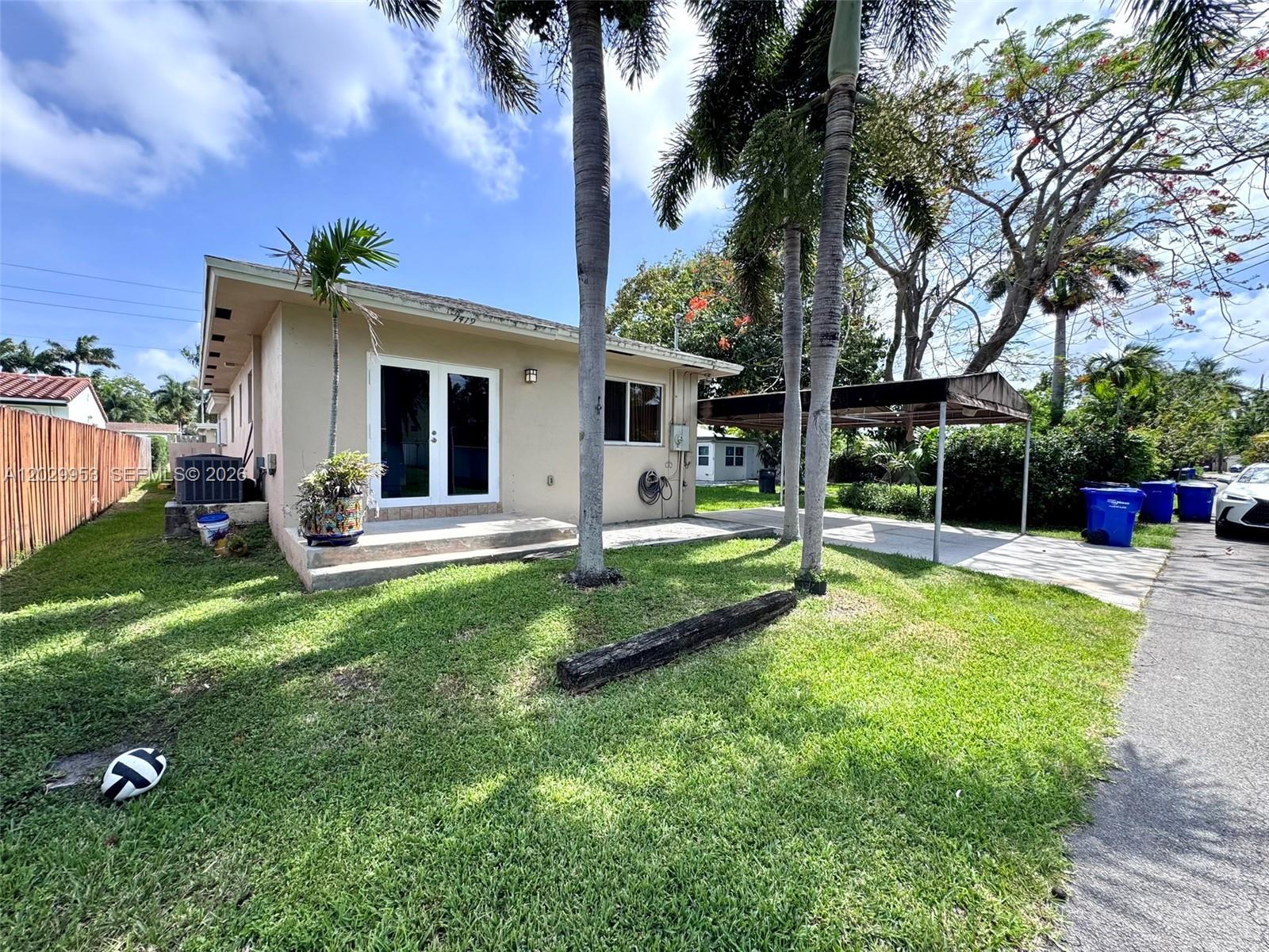 Tucked away in a quiet Hollywood neighborhood, this beautifully maintained 2-bedroom home offers a rare combination of privacy, comfort, and convenience. With its own private entrance, separate driveway, covered carport, and dedicated yard area, the property lives more like a single-family home than a duplex. Inside, you'll find custom built-in closets, impact windows and doors, a well-appointed kitchen, a stylish bathroom, spacious living room and the added convenience of its own private washer and dryer.
The location places you just blocks from Hollywood Beach Golf Club and only minutes from Hollywood Beach, local parks, restaurants, and shopping. Whether you're enjoying a day by the ocean or relaxing at home, this residence offers an easy and comfortable lifestyle in a well-established residential setting.