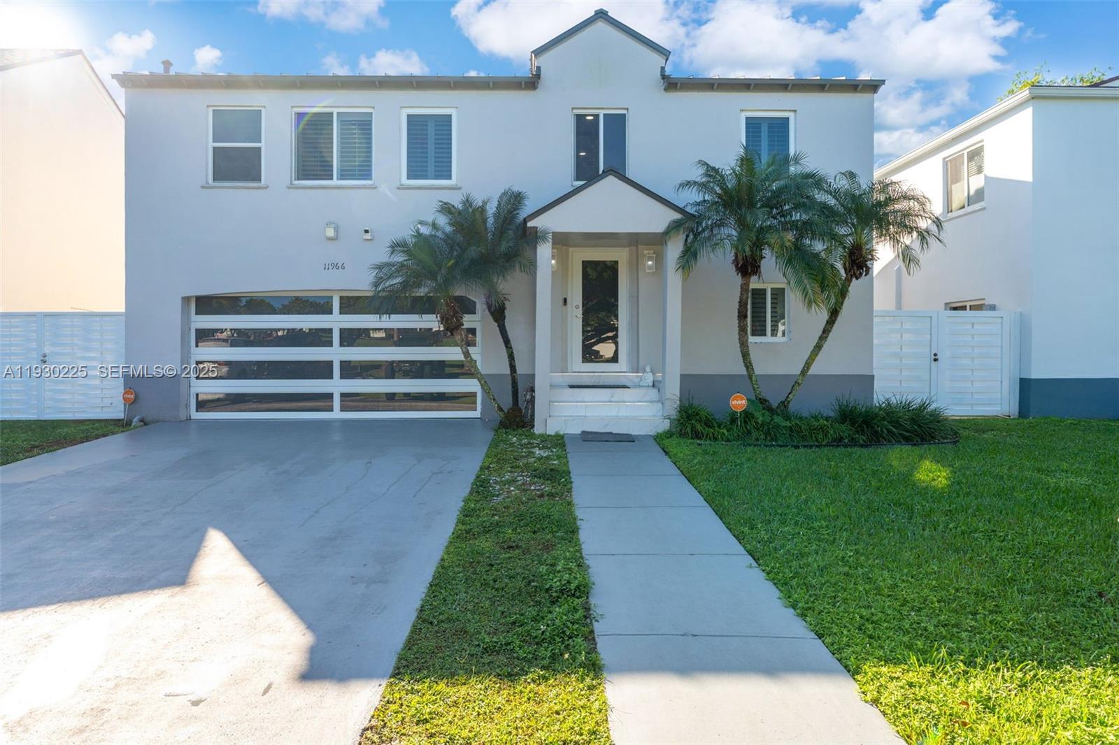 Stunning, fully renovated residence that delivers modern luxury, space, and style in every detail. This expansive 5-bedroom, 4-bath two-story home also features a dedicated office plus upstairs living area, ideal for a media room, playroom, or second family lounge.

From the moment you arrive, the home impresses with crisp contemporary curb appeal, tropical palms, a private drive, and a sleek glass-panel garage door. Major upgrades include a metal roof and impact windows & doors for added peace of mind.

Inside, a bright open-concept design is finished with glossy oversized white tile and recessed lighting, creating a clean, airy feel throughout. The showpiece kitchen is straight out of a magazine, featuring striking high-gloss blue cabinetry, stainless steel appliances, and an oversized waterfall-style island with seating—perfect for entertaining and everyday living.

The main living and dining areas flow seamlessly to the outdoors through sliding glass doors, enhancing indoor-outdoor living. Spacious bedrooms, plantation shutters, and beautifully updated finishes complete this move-in-ready home.

A rare combination of design-forward updates, flexible living spaces, and premium upgrades.

 GREEN CORRIDOR PACE will be paid at closing lowering the tax bill substantially for the new buyer. Easy to show!