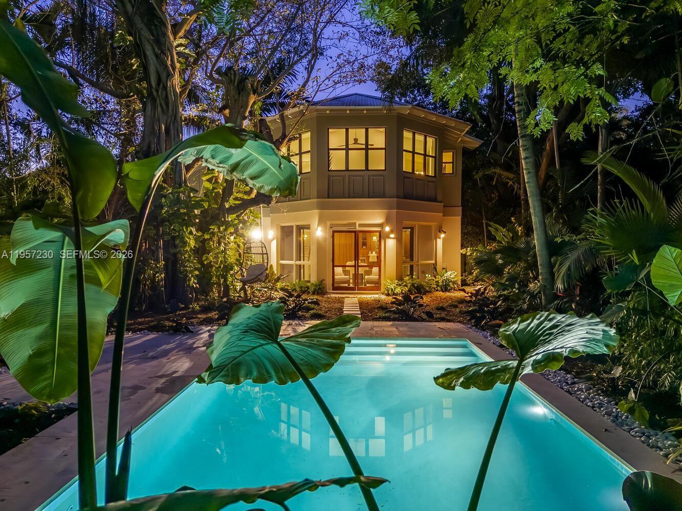 Introducing a bespoke architectural residence thoughtfully designed to blend the timeless character of Coconut Grove with modern comfort. This brand new construction by renowned architect Luigi Vitalini reflects refined craftsmanship, intentional design, and a seamless connection to the surrounding natural landscape. Interiors feature custom American walnut cabinetry, Kohler fixtures, JennAir appliances, and a combination of large format porcelain tile and solid oak wood flooring. The expansive great room opens effortlessly to a screened patio, creating a natural indoor outdoor flow where you are safe from the mosquitoes. A hard wired Aural stereo system, controlled by smart devices, enhances both everyday living and entertaining. The property is situated on the very top of the highest natural ground in Coconut Grove, called the Miami Rock Ridge, a limestone formation with elevations generally ranging from approximately 10 to over 20 feet above sea level. This elevated and stable terrain offers a notable advantage compared to surrounding lower lying coastal areas. The home’s design thoughtfully responds to the site’s elevation, with a lower level foyer that reflects the architect’s intentional approach to the land. Property sits on an impressive 8,750 sq ft lot with a garage. This property has a huge garden for all to enjoy, roam, and explore safely behind a 6' fence. The pool comes with a safety net anchored into the coping, instead of the standard pool fence.