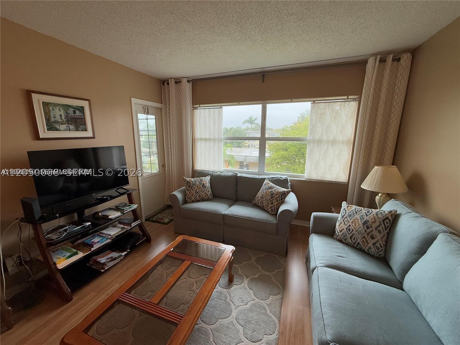 TURN-KEY FURNISHED 1 bed/1 bath located in the 55+ community of Lauderhill East. This building has elevator and is located on the top floor, therefore no upstairs neighbor. All windows are hurricane impact and front door was replaced last year. 40th year inspection has been done and there are no special assessments. Bathroom has access from both the bedroom and hallway area. Living room is equipped with a pull out couch and leads to the enclosed Florida room. Both living room area and balcony have a garden view overlooking the clubhouse. Additional locker and laundry room are located on the same floor. Water heater is from 2022 and parking number is #62. Rentals after 1 year, 2x per year (7 months max, no yearly)
