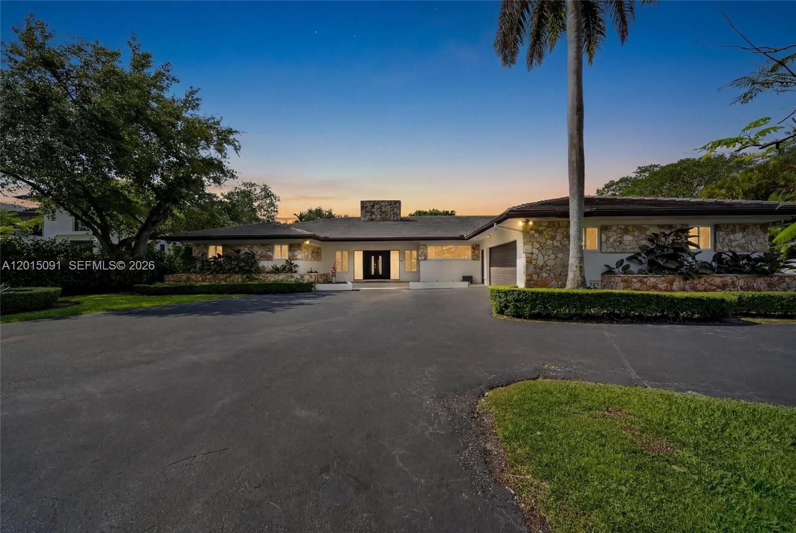 Welcome to Casa La Roca, located in the heart of Pinecrest. This beautifully remodeled estate home offers over 6,400 square feet of luxurious living space, featuring 5 bedrooms and 4 bathrooms, all nestled on a private gated builder’s acre. Designed for both comfort and entertaining, the home showcases soaring volume ceilings, a stunning stone fireplace, and impact windows and doors throughout. The expansive gourmet kitchen includes a spacious breakfast area perfect for everyday living and gatherings alike. The oversized primary suite serves as a private retreat with a brand-new spa-inspired ensuite bathroom featuring a soaking tub, oversized shower, sauna, and steam room. Step outside to enjoy resort-style amenities including a newly remodeled heated 15x46 pool, racquetball court, basketball court, and pickleball court — ideal for outdoor sports enthusiasts. End your evenings beneath the custom pergola and summer kitchen, perfect for outdoor dining surrounded by a beautiful canopy of mature trees.

For a private tour or additional information, please contact the listing agent.