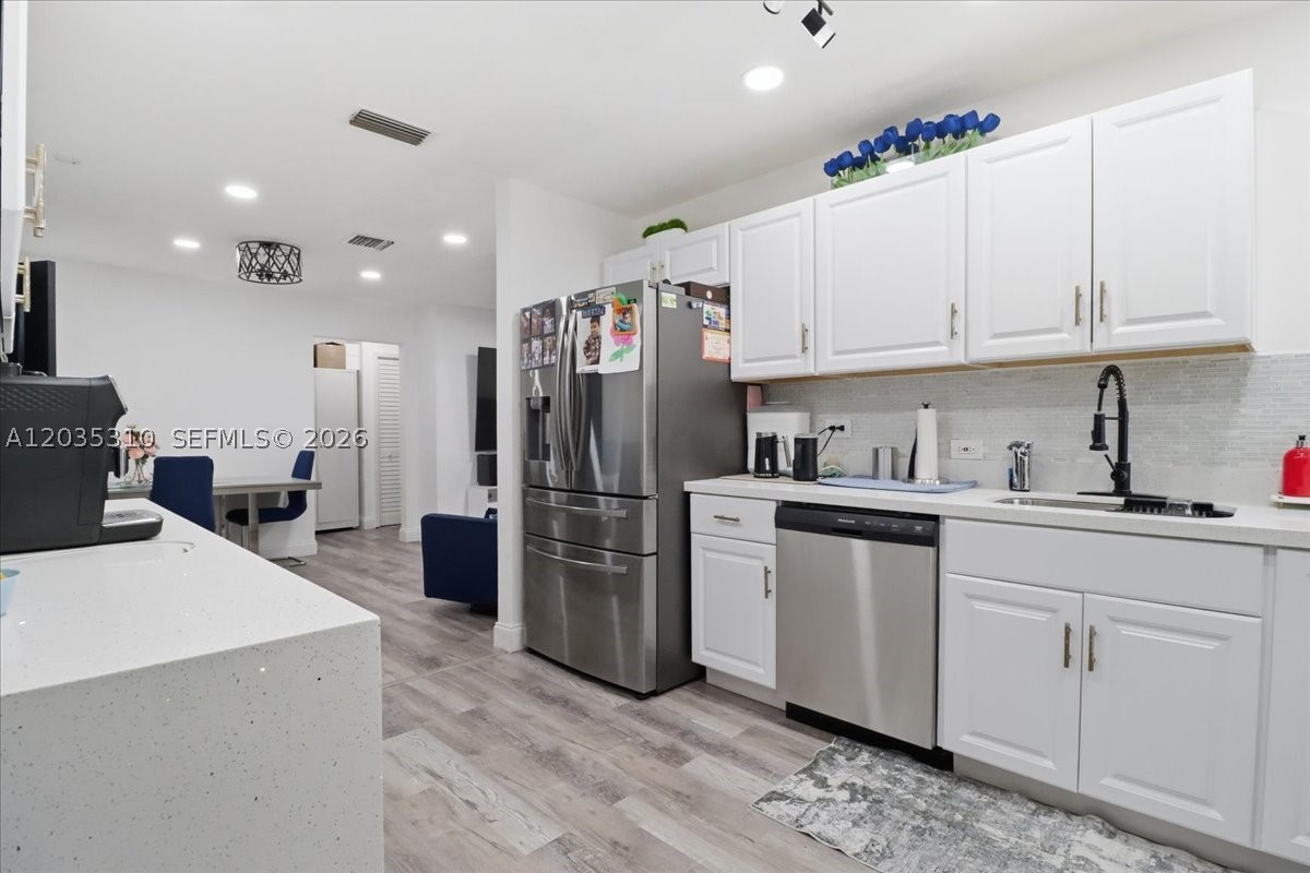 Introducing a stunning 3-bedroom, 2 bathroom with Laundry Room. This home is Nestled in a vibrant city of Hollywood. This property boasts a brand-new kitchen with white cabinets, quartz countertops & modern stainless steel appliances. The bathrooms have been elegantly remodeled, Oversize lot with covered terrace and plenty of room to build a dream pool to entertain guest and family. New shutters and roof 2025. No Association with endless restrictions. Dont miss out on this perfect property for a family looking for a forever home, or investment.