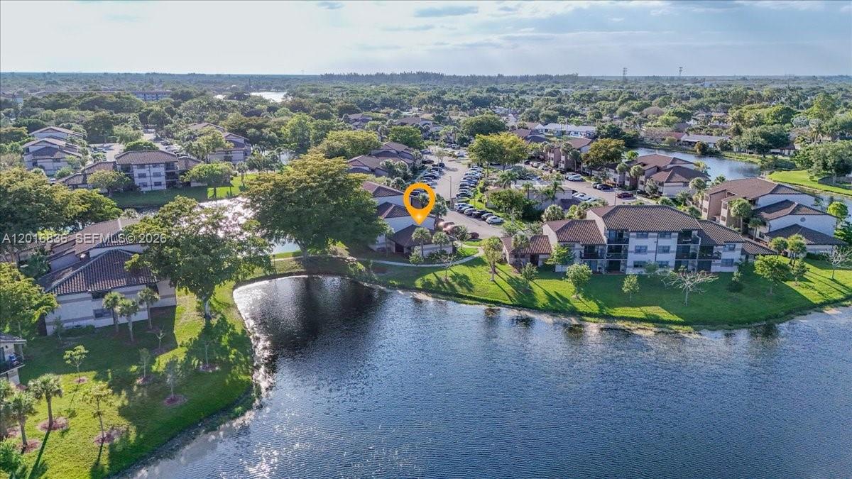 Beautiful and bright corner unit villa on the first floor with amazing lake views. Very private and quiet with no neighbors above or below! It feels like a house! Modern kitchen with stainless steel appliances, new floors throughout the entire unit, updated bathroom, high ceilings, great closet space, full size washer and dryer inside the unit. Enjoy the exclusive patio surrounded by colorful landscape and water views. The community offers resort-style amenities including two pools, tennis courts, exercise room, walking trails, BBQ areas. Centrally located in the heart of Sunrise close to Sawgrass Mills shopping, supermarkets, restaurants, banks, and Sawgrass Expressway. A must see!