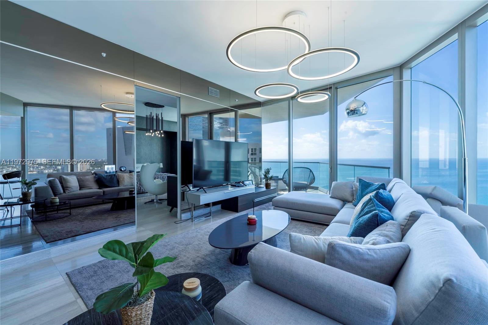 Live the Armani dream at this oceanfront masterpiece in Sunny Isles Beach, Florida. Exquisite 2-bed + den apartment stuns with panoramic ocean & city views through 10-foot ceilings & expansive windows. Step into a haven of exquisite, elegantly designed units, with top-of-the-line appliances & gleaming stone countertops. Dive into endless world-class amenities: private oceanfront dining, serene Armani Spa, movie theater, cigar rooms, playful children's zone, & state-of-the-art fitness center with direct beach access. Own a piece of the Armani legacy & experience luxury reimagined. The property is fully furnished and includes all decorations in the price. Maintenance fee includes valet, basic internet and cable, and water. Ready to move in!. Please use showing time for showing. DO NOT TEXT THE REALTOR FOR SHOWING