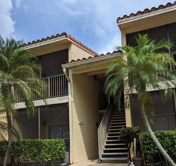 Introducing an exceptional 1 bedroom, 1 full bath condominium that offers a fresh allure with brand new flooring in the living room and bedroom area. Requiring 1st MONTH & DEPOSIT ONLY. Enjoy modernized appliances, including washer and dryer. Step onto the screened patio with a convenient storage room. Nestled within a secure gated community in a highly desirable locale, this residence provides swift access to Turnpike, Publix, Walmart, Walgreens, banks, and Windmill Park. Delight in the abundant amenities of Royal Poinciana, featuring an expansive resort-style swimming pool, well-equipped gym, inviting clubroom, and a racquetball court. The presence of night security personnel ensures peace of mind. Welcome to your new home!
