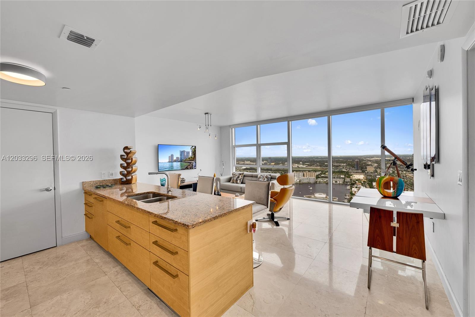 Beautifully maintained high-floor 1-bedroom, 1-bath residence offering breathtaking unobstructed Intracoastal, city, and sunset views. This spacious and light-filled home features marble floors throughout, floor-to-ceiling glass, an open European-style kitchen with granite countertops and KitchenAid appliances, an oversized primary suite with generous closet space, and a separate laundry room. Move-in ready and impeccably cared for, this residence is located within the prestigious Beach Club community, offering an unmatched oceanfront lifestyle with world-class amenities including resort-style pools, full beach service, a 50,000-square-foot fitness center and spa, concierge, 24-hour security, valet parking, and more.