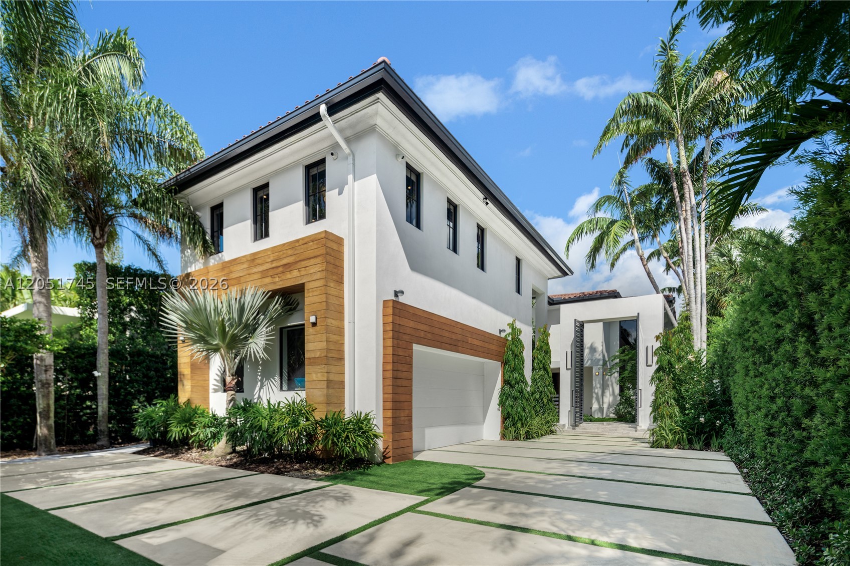 Dive into the tropical fully-renovated turnkey waterfront Modern Mediterranean villa boasts 6 beds/7 baths w/ white oak wood floors, arched doorways, floor to ceiling glass windows unveil natural light & water views. Gather by the fireplace & entertain in the living room w/ 20 ft high ceilings, a built-in bar and a kitchen with high end appliances, fridge & sink with marble countertops. Primary suite brand new custom master closets, outdoor balcony, views of the water, dual vanities & oversized soaking tub. Brand new floor to ceiling new glass doors blur the lines between interior & exterior spaces. 2 car garage. Auto-blinds offer privacy & light control as well. In the backyard there is an outdoor BBQ, pizza oven, pool & spa, sauna & cold plunge, covered terrace, new dock w/ shore power.