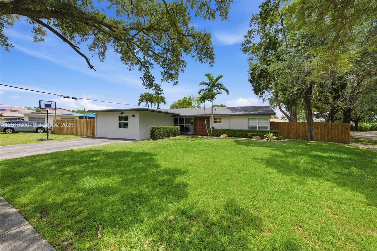 Don't Miss This Stunning 4-Bed / 2 Bath Single-Family Home Situated On An A Large Oversized Fenced Corner Lot In The Desirable Lawn Acres Community In Hollywood! (4th Bedroom Is Optional Office/ Private Living Area/ Efficiency). This Home Boasts A Spacious And Airy Open Layout With Lots Of Natural Light. Terrazzo And Luxury Vinyl Floors. The Large Eat-In Kitchen Is A Chef’s Dream, Featuring Stainless Steel Appliances, A Kitchen Island With Granite Countertops, Modern Glass Tile Backsplash, And Ample Cabinetry. LED Recessed Lighting. Primary Suite Serves As A Private Retreat, Offering A Generous Walk-In Closet And Blackout Curtains. Stylish Barn Door Leads To The Newly Updated En-Suite Bathroom, Complete With A Large White Vanity, Frameless Glass Shower Enclosure, And A Push-Button Toilet. Two Additional Bedrooms Share An Updated Hall Bathroom Featuring A Modern Vanity And Shower/Tub Combination With Frameless Enclosure. The Dedicated Laundry Room Provides Extra Storage And Direct Outdoor Access. Major Upgrades Offer Total Peace Of Mind: Extended Driveway, Roof (2018), AC (2022), Updated Electric Panel, Water Heater (2022). Step Outside To An Expansive Backyard Oasis, Perfect For Entertaining Or A Playground. Enjoy The Above-Ground Pool With A Custom Wood Deck, Fully Fenced For Maximum Privacy, Plus A Shed For Additional Storage. Perfectly Located Near Major Highways, Shopping, Dining, The Hard Rock Guitar Hotel, And Airports. No HOA! Must See!