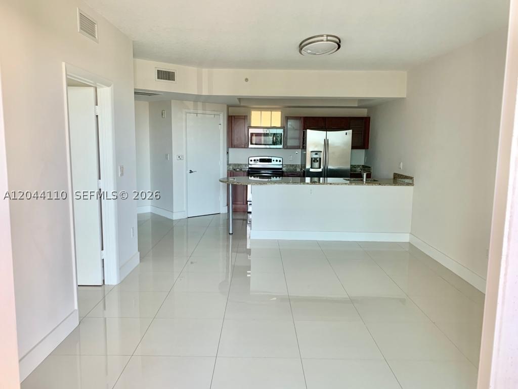 BRIGHT & SPACIOUS 1-BEDROOM RESIDENCE IN THE HEART OF DOWNTOWN DADELAND! This beautifully maintained 1-bedroom, 1-bath unit offers a comfortable 749 SF open layout with abundant natural light, white tile flooring throughout, a modern kitchen, and a generous living area perfect for relaxing or entertaining. Enjoy the convenience of an assigned parking space in a secure garage and the exceptional lifestyle offered by this full-service building, featuring resort-style amenities including a sparkling pool, fitness center, and on-site management.
Located in the highly desirable Downtown Dadeland community, just steps from premier shopping, dining, cafés, MetroRail, and everyday conveniences. Easy access to major highways, Coral Gables, South Miami, and Downtown Miami. A fantastic opportunity to experience the best of urban living in one of Miami-Dade’s most convenient and sought-after locations!