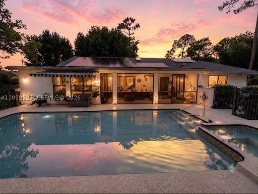 Tucked right in the vibrant heart of Wellington,4/2/2 (den conversion) + office turnkey masterpiece is architecturally designed by a high-end professional team for an immediate 'wow' factor. Sitting on a fenced 0.5 acre lot with a breathtaking, serene botanical garden sanctuary, the home features a 2022 roof, spacious 4BR/2BA split plan (4th bedroom is Den conversion).  The interior features imported Spanish porcelain flooring throughout for a smooth, welcoming feel. Formal Dining room. The chef’s kitchen boasts quartzite Taj Mahal countertops, custom walnut cabinetry, and premium Café appliances with an induction island cooktop and a separate built-in Advantium® 5-in-1 wall oven(WiFi). Nearby, a utility room offers an LG W/D with matching custom walnut cabinets. A large home office faces the spectacular gas-heated pool with Spa (new pump), solar hot/cold outdoor shower, screened patio with hurricane protection. A/C 2019 & ceiling fans keep the interior perfectly cool. A custom impact skylight, Plantation shutters, a hurricane garage door, impact windows, shutters & panels offer complete storm peace of mind.  The property operates on a solar system, city water, septic, and full irrigation via a brand-new 2026 well pump. Lush, mature fruit trees complete this secluded oasis. Enjoy total privacy with NO HOA, just minutes to world-class equestrian venues, dining, shopping, and the Turnpike. Top "A"-rated schools in a family oriented town—simply turn the key and live your dream.
