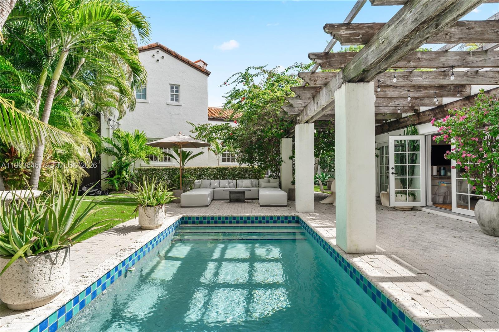 Welcome to one of the rarest historic estates in the best of Coral Gables’ iconic villages: The Italian Village. Originally designed by 2 of Miami's most storied architects, John & Coulton Skinner, the 1926 home is one of the finest examples of Mediterranean revival architecture featuring a clean stucco exterior, an entry courtyard, a 1 bed 1 bath guest house and one of the most magical pool areas in the city complemented by covered pergolas, patios and even a sauna tucked in the lush tropical foliage. Inside has been completely renovated with high-end Italian finishes blending seamlessly with the original, timeless historic details. The great room features 11ft ceilings & 2 walls lined with French doors & windows flooding the home with natural light and providing easy connection to the outdoors. 2 bedrooms lie within the main residence while an exterior stone staircase leads to a private tower suite and a covered pergola leads to the separate guest house offering unique flexibility to create a maid’s quarters, in-law suite or recreation/media rooms. Additional features include: eat-in kitchen with 6-burner gas range, formal dining with built-ins, modern baths with smart toilets, whole home water filtration and keyless entries. Tucked within one of the Gables' most picturesque neighborhoods lined with manicured lawns and grand historic estates all within moments to Miracle Mile and Biltmore Hotel & Golf Course, Coconut Grove’s vibrant village center and Brickell & Downtown.