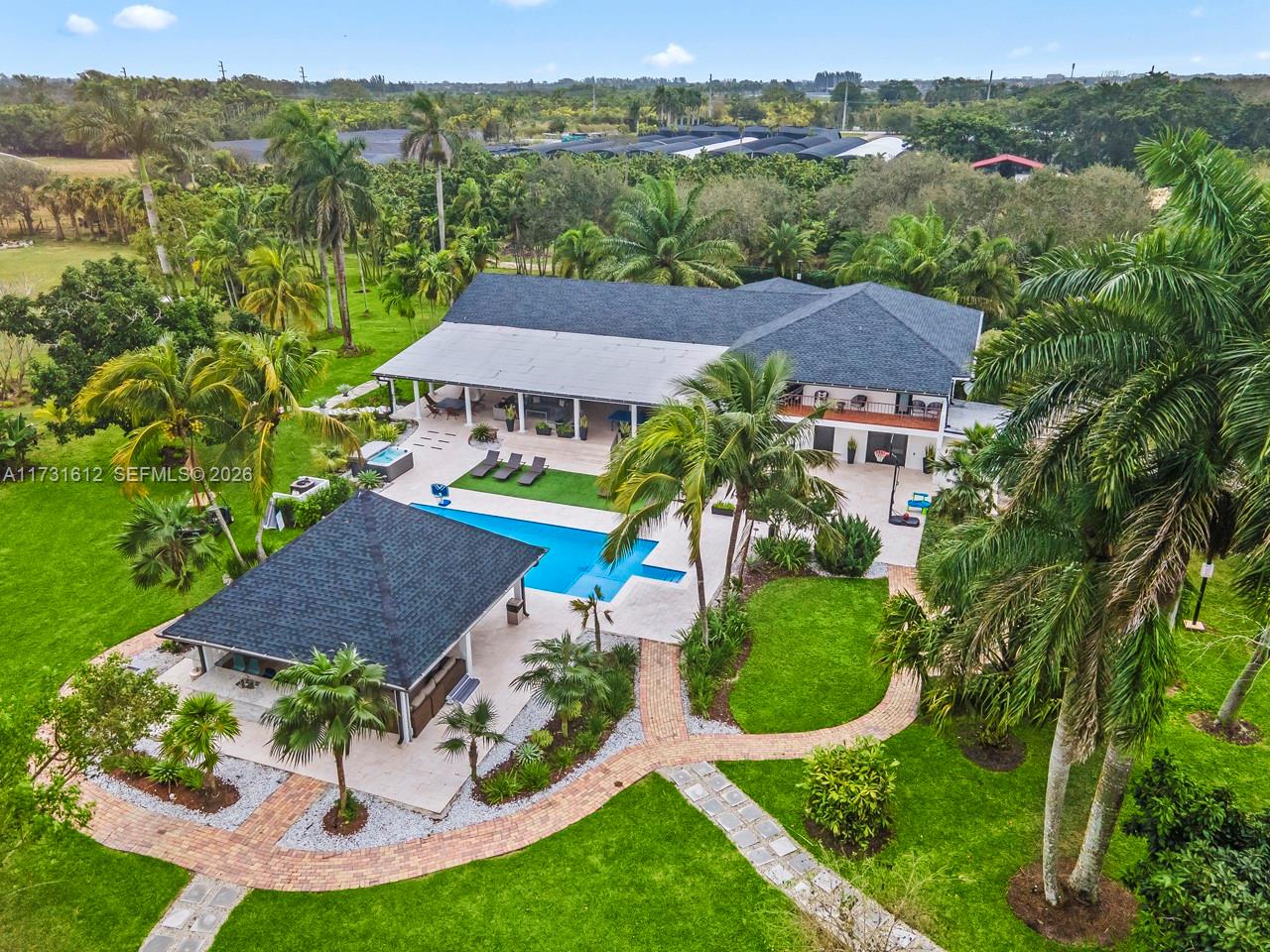 This spectacular house of almost 5 acres offers an experience close to nature, a unique country life, surrounded by different trees. Don't miss the experience of living in a perfect place for you and your family where you can enjoy nature, large spaces completely renovated and equipped for indoor and outdoor entertainment including tennis and soccer courts It also can be used or rented for different types of party events. It has 3 rooms on the second floor and 2 rooms on the ground floor and 6 Baths in the Redland property located minutes from West Kendall.
