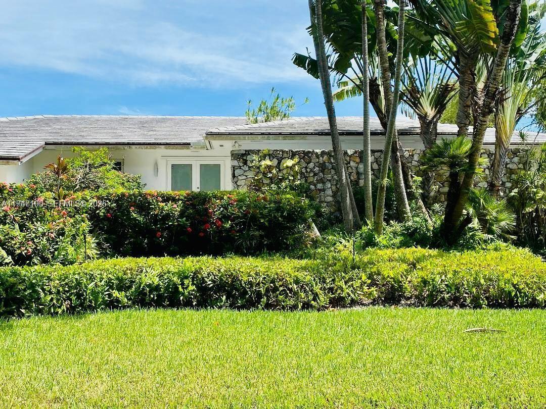 This beautiful house sits on an elevated lot in prestigious Gables by the sea. A gated community with a "voluntary HOA fee". It features modern finishes, an updated kitchen w/ quartz countertop, 4 spacious bedrooms (2 en-suites), a home theater/den that can double as a 5th bedroom, and 3.5 bathrooms. Enjoy the safety and tranquility provided by impact windows and doors, covered outdoor area, a large 2 car garage and more. The private designer dock and seawall offer the perfect spot to witness breathtaking sunrises and sunsets. As night falls, the underwater lighting turns your dock into a mesmerizing display, showcasing the marine life and creating the ambiance of your own personal aquarium. Located near top-rated A+ schools. Contact owner/agent for showings. *No ocean access*